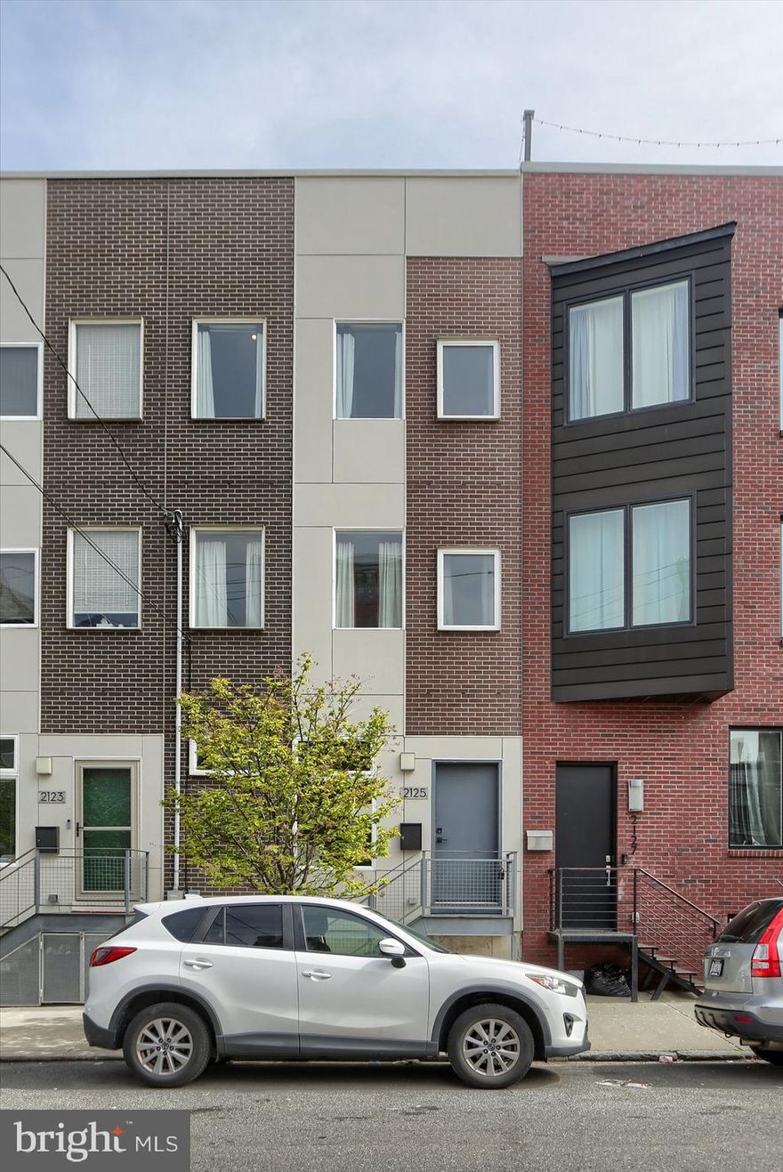 Set your appointment today to see this fully-firnished 17- foot-wide town home with 3 bedrooms, 2.5 baths, finished basement, roof deck and impressive interior finishes. The new construction tax abatement is valid thru January 2026. The open concept floor plan features sophisticated Sandstone oak hardwood floors throughout, high ceilings and an abundance of natural light from the numerous windows and a breathtaking 2-story light well that is absolutely uplifting!  The kitchen has island seating, quartz counter tops, custom tile back splash, and a stainless-steel appliance package. From the kitchen you can access your own private garden. The first level also includes a coat closet and convenient powder room. The 2nd floor has a dazzling Master Suite. A pocket door opens to the bedroom, a walk-in closet, and an en-suite master bathroom. The rest of the second floor is a large flex space with large picture windows which is currently used as an office. The 3rd floor has 2 bedrooms with plenty of closet space, a large laundry room, a shared hall bath with soaking tub and shower combined. This stunning home includes recessed lighting throughout, two zone heating and air conditioning, a panoramic rooftop deck with skyline views. There is also a finished basement and utility room, smart home technology including WiFi controlled thermostats. Let's not forget this home is conveniently located on Cumberland Street tucked between Frankford Ave and historic, cobblestoned Trenton Ave.