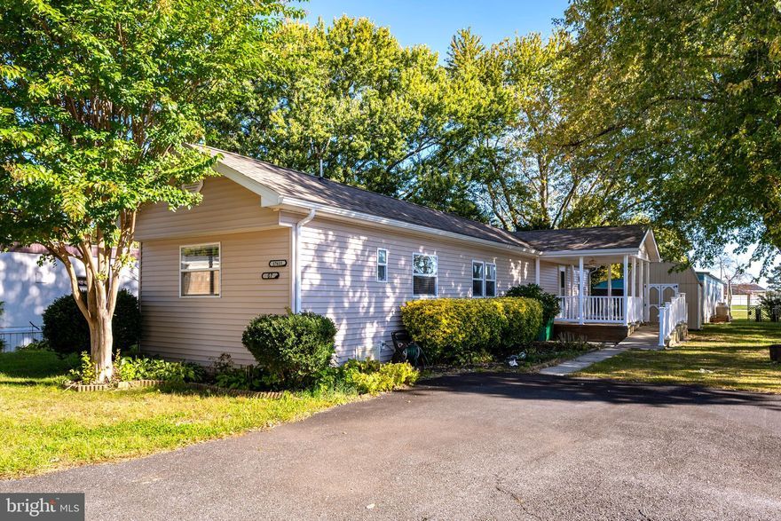 Welcome to Whispering Pine in Lewes! This updated and exceptionally maintained 3 bedroom, 1.5 bathroom home offers comfortable single-level living in one of the area’s most desirable mobile home communities. Step inside to find luxury vinyl plank flooring throughout the spacious bedrooms (3rd bedroom currently converted to laundry area/ storage) and bright family room, along with a ceramic tile floor eat-in kitchen featuring a tile backsplash, ceiling fan, and ample cabinetry. The home provides plenty of storage throughout for easy, organized living. The main entrance leads to a charming side porch with a ceiling fan and ramp access — perfect for relaxing outdoors. Additional features include off-street parking for 4 and a convenient storage shed. Enjoy community amenities including a pool, basketball court, playground, and covered pavilions. Ideally located just minutes from downtown Lewes, beaches, dining, and shopping — this home perfectly blends comfort, updates, and coastal convenience! **Please note, there is a monthly lot lease of $918 paid to the trailer park**