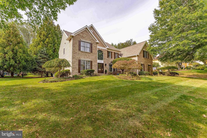 Welcome to 74 Old Mill Drive, a 4-bedroom, 3.5-bath single-family home in the highly sought-after Rose Tree Estates neighborhood of Media, within the award-winning Rose Tree Media School District. Step inside to a grand two-story foyer with hardwood floors, crown molding, wainscoting and a beautiful sparkling chandelier. To the left, the living room features hardwood floors, chair rail, and crown molding, while to the right, the formal dining room offers matching details and a chandelier. The main level continues with a stunning library complete with built-in cabinetry and wall sconces with a convenient powder room tucked nearby. A spacious family room boasting hardwood floors, vaulted ceilings with skylights, a ceiling fan, and a brick gas fireplace — perfect for gatherings or cozy nights in. The breakfast room offers casual dining space with hardwood floors, skylights, custom wine and coffee bar with sink and wine fridge, and direct access to the deck. The backyard is a private oasis, backing to mature trees for peace and tranquility. The kitchen is a chef’s dream, featuring Wolfe stainless steel appliances, marble countertops, a farmhouse sink, marble backsplash, and a peninsula with seating. A laundry room with tile flooring, built-in cabinets, and garage access completes the main level. Upstairs, the primary suite is a true retreat with hardwood floors, a sitting room, three walk-in closets, and a ceiling fan. The luxurious en-suite marble bath with a double vanity, built-in cabinets, a walk-in shower, and a separate soaking tub. An additional office space with hardwood floors and vaulted ceilings offers flexibility. Three more bedrooms, two with carpet, one with hardwood and all with ceiling fans, share a full hall bath with a double vanity, marble floors, and a glass-enclosed marble tub/shower combo. The finished walk-out basement expands the living space with a second full kitchen featuring quartz counters, stainless steel appliances, and a dining area. This level also includes a home gym, a second family room ideal for a home theater, a full bath with walk-in shower, and generous storage space. Not only does this home deliver on space and amenities, but it is also centrally located to shopping, restaurants, and entertainment, along with easy access to I-476 and Route 1 for convenient commuting. Don’t miss your chance to make 74 Old Mill Drive your new home!