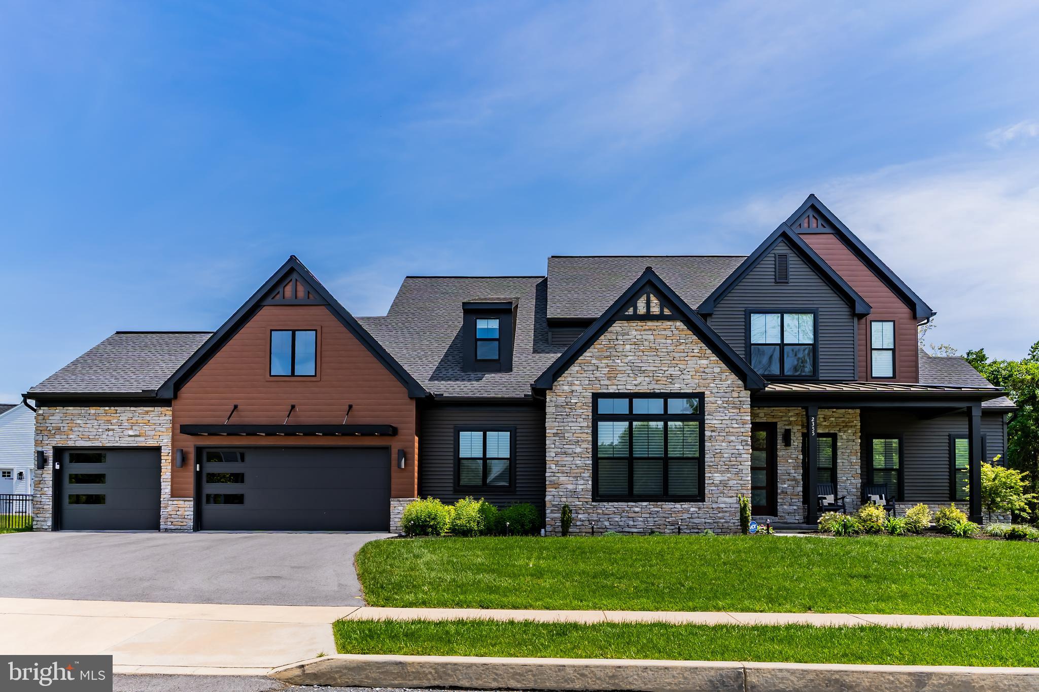 Experience timeless elegance and modern luxury in this stunning 4-bedroom, 3.5-bath home located in the desirable Westbury Meadows community. Built in 2023, this stately two-story residence blends classic Craftsman charm with designer finishes and thoughtful details throughout. The eye-catching exterior features fiber cement siding, beautiful stone veneer, a welcoming front porch, stamped concrete walkway, and a 3-car front-load garage—complete with a Tesla charger. Inside, you're greeted with a functional entryway equipped with custom lockers and a bench for everyday convenience. To the front of the home, a private study offers the perfect work-from-home setup, while the elegant formal dining room showcases a soaring cathedral ceiling with stained wood beams. A butler’s pantry connects the dining room to the open-concept kitchen, which boasts quartz countertops, a tile backsplash, stainless steel appliances, a large center island, and a spacious walk-in pantry. The bright and airy breakfast area opens to a screened-in patio, ideal for enjoying the outdoors in comfort. At the heart of the home is the dramatic 2-story great room, featuring a gas fireplace with a stone surround and box beam mantel—perfect for cozy gatherings. Retreat to the luxurious owner’s suite with a tray ceiling, dual quartz vanities, a freestanding tub, a custom tile shower, and a huge walk-in closet with direct access to the laundry room—a truly functional design. Upstairs, you’ll find three generously sized bedrooms, two full bathrooms, and a versatile loft area, perfect for a secondary living space, playroom, or media zone. Don't miss this rare opportunity to own a nearly new home loaded with high-end upgrades and thoughtful touches in a prime location. Schedule your private tour today!