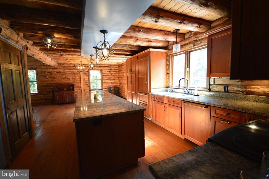Your opportunity to escape the ordinary is HERE! Come home to this custom-built log home tucked away on over seven unrestricted peaceful acres in the heart of Virginia’s countryside. Just a short drive west of the DC Metro area. Surrounded by towering trees and visiting wildlife, this property offers the perfect balance of seclusion and convenience — a sanctuary that everyone seeks.

Step inside to discover the warmth and craftsmanship only a true log home can offer. The open-concept design, modern and rustic finishes. Expansive windows invite the natural light and forest views to flow through every room. Enjoy mornings on the porch with deer grazing nearby, evenings by the fireplace, and weekends spent reconnecting with nature and loved ones of the masses or just a select few. 

Whether you envision a full-time residence or a weekend getaway, this property delivers both comfort and opportunity. There’s ample space to create your dream  — with gardens, animals, or a private hobby farm. Maybe you prefer the simple tranquility of rural living without giving up access to nearby hospitals, shops, and community amenities and culture. This property investment is going to speak to you as well. 

For city dwellers seeking a retreat, 450 Opequon Woods Drive offers easy access from the metro area, and local maintenance programs make part-time living completely hassle-free. This is more than a home — it’s a lifestyle, a gathering place for family and friends to make lasting memories, and an investment in your family’s peace, privacy, and financial security for generations to come. Call for private showings.