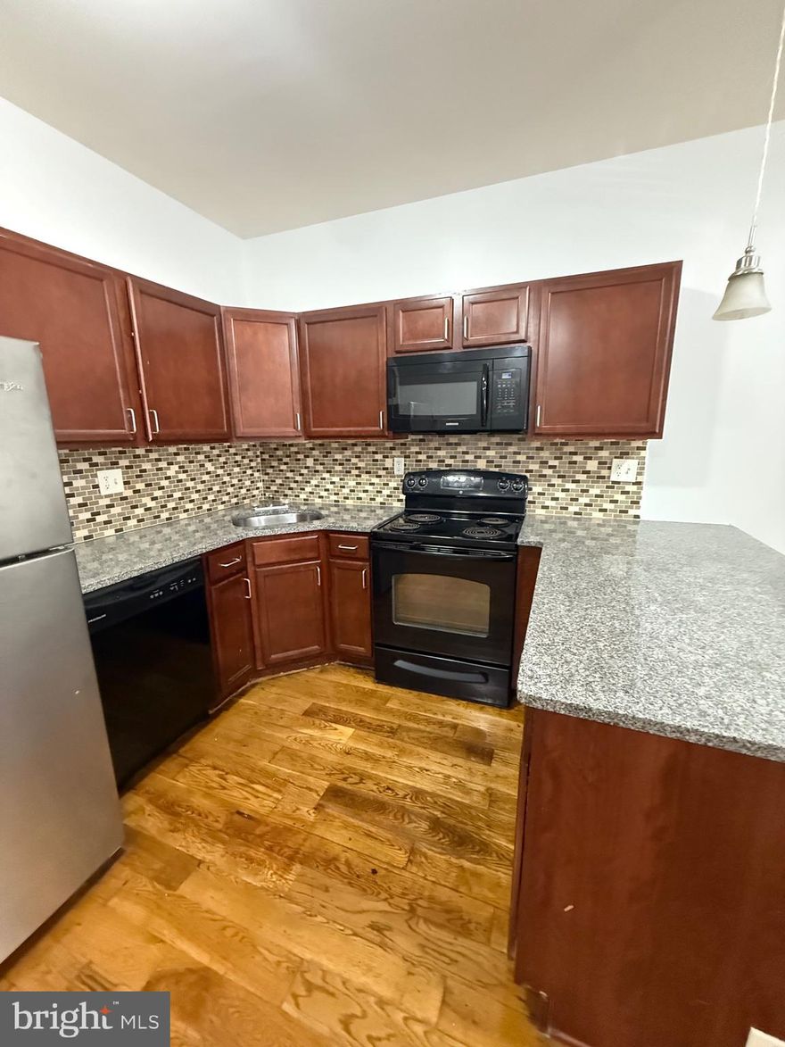 This spacious first-floor apartment features four bedrooms and four full bathrooms, perfect for families or roommates looking for comfort and privacy. The unit boasts beautiful hardwood floors throughout and central air conditioning to keep you comfortable year-round. The modern kitchen includes an electric stove, refrigerator, microwave, and dishwasher, and a washer and dryer are also included for your convenience.

Small pets are welcome with a one-time $250 pet deposit. A $30 monthly water fee applies to each adult occupant, and tenants are responsible for electricity. Private parking is available for an additional $125 per month, and a bus stop is conveniently located right out front, making commuting simple and stress-free.

This well-equipped, pet-friendly apartment offers both space and convenience in a great location. Contact us today to schedule a tour or learn more.