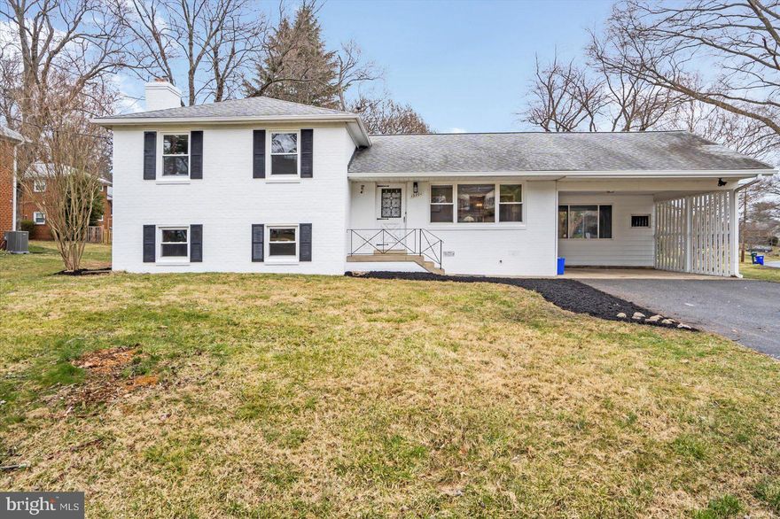 Beautifully renovated split foyer in Carol Acres. The main level has a large living room with a separate dining room and newly renovated kitchen. The kitchen has new shaker style cabinetry, quartz counters, stainless steel appliances and ceramic tile floors. Directly off the dining room is a den/office which is also
accessible by the rear and carport. The 2nd floor boasts 3 bedrooms and 2 full bathrooms. Both bathrooms have updated ceramic tile, vanities and fixtures. The lower level has a large family room with a fireplace. Directly off the family room is the laundry/utility room and a half bathroom. There is plenty of storage available either in the attic which has easy stair access or the roomy crawl space which is accessible within the laundry area. The hvac system has been recently updated and the electrical panel is new with a 200 amp service. The windows are also new. **appraisers**The tax record sq/ft is incorrect as the den/office on the main level is not included in the above grade sq/ft. Above grade sq/ft is approximately 1450 sq/ft.