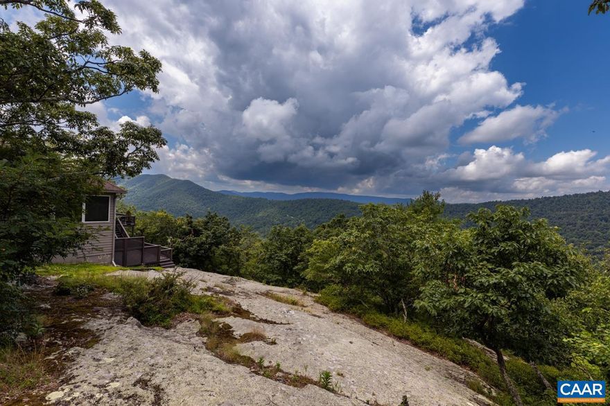 This is a cozy view property with views to the south and west. Located in the desirable Fortunes Ridge area of Wintergreen with easy access to the mountain amenities or valley.  The main living area features warm tile, heart pine floors, lovely built-ins and a wood burning stone fireplace.  The three bedroom configuration comfortably sleeps two couples and four or more children.  This is a great jumping off point for your Blue Ridge adventures.,Formica Counter,Wood Cabinets,Fireplace in Living Room