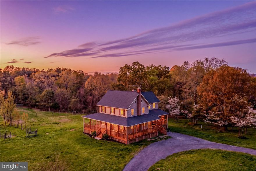 Escape to your own private West Virginia retreat at 344 Tub Run Hollow Rd, where a beautifully updated, solid custom-built home, wrap-around porch, and peaceful setting come together to create a truly special property. Tucked at the end of a quiet country lane, this homesite offers the privacy and tranquility you’ve been looking for.
The home has been thoughtfully updated, blending modern comfort with timeless country charm. Built with quality craftsmanship, this solid custom build offers durability you can feel the moment you walk in. Some recent improvements include two new HVAC systems and a 50-year architectural roof, providing comfort and peace of mind for years to come. Inside, you’ll find warm, inviting living spaces with fresh finishes, abundant natural light, and a layout that flows effortlessly for everyday living and entertaining. Multiple bedrooms with new carpets and brand new baths provide flexibility for family, guests, a home office, or hobby space.
Step outside and the wrap-around porch steals the show—perfect for morning coffee, evening sunsets, or simply taking in the peaceful surroundings. Just beyond the home, a large outbuilding adds incredible value and versatility, offering space for garage parking, a workshop, equipment storage, barn or a combination of all three.
Set on its own 12.96 acres, this property offers the perfect balance of privacy, usability, and low-maintenance country living. Located in desirable Berkeley County, you’ll enjoy that “away from it all” feel while still being within a convenient drive to Martinsburg, local amenities, and major commuter routes.
If you’ve been searching for an updated, move-in ready home with incredible porch living, a functional outbuilding, and the confidence of a solid custom build, 344 Tub Run Hollow Rd is a must-see.