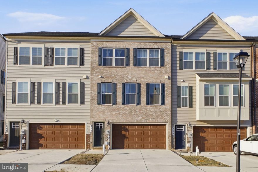 Welcome to your new home in the heart of Accokeek — a beautifully designed 3-level townhome offering 3 bedrooms, 2 full baths, and 2 half baths, nestled within one of the area’s most desirable and amenity-rich communities. Built as a new construction in 2023, the home is thoughtfully crafted with modern finishes, an open-concept layout, a two-car garage residence, and tons of natural lighting. Step inside to discover a bright and airy floorplan anchored by a central kitchen featuring stainless steel gas appliances, a farmhouse sink, and a spacious center island perfect for casual dining or entertaining guests. The kitchen flows seamlessly into the great room, which provides direct access to a double deck — creating the ideal setting for hosting gatherings or peaceful outdoor moments.

The home offers multiple living areas designed for comfort and versatility. The lower level includes a recreation room and powder room, providing additional flexible space for a home office, media room, or play area. Upstairs, retreat to the luxurious Owner’s Suite complete with a walk-in closet and private en-suite bath. Two additional generously sized bedrooms and a full bathroom complete the upper level, offering ample space for family or guests.

The Signature Club community offers exceptional amenities including a clubhouse for neighborhood gatherings, a multi-sports court with basketball and pickleball, multiple playgrounds, and expansive open green spaces. This home’s prime location offers convenient access to Capitol Hill, DC, northern Virginia, and southern Maryland. Don’t expect this home to be on the market for long — schedule your showing today!