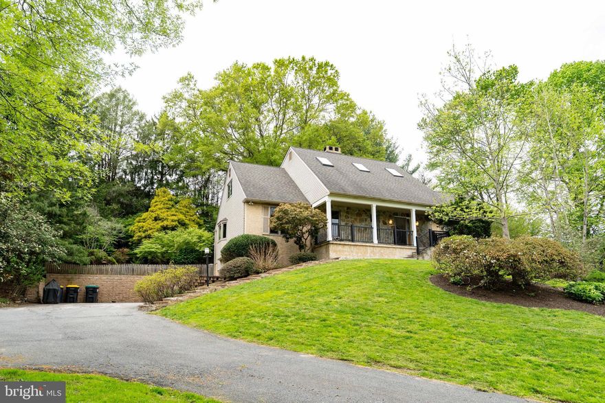 ​Welcome home to this stunning natural retreat, conveniently situated just minutes from several parks and scenic walking trails in Pike Creek. As you make your way up the driveway, you’re greeted by this expansive Cape Cod-style home—offering timeless charm, exceptional space, and a setting that truly feels like a private getaway every time you arrive. Upon entering, a grand foyer with vaulted ceilings and beautifully refinished hardwood floors extend throughout the first level. The step-down living room offers a warm and inviting atmosphere, highlighted by a quaint wood-burning fireplace. Flowing seamlessly, you’ll find a spacious dining room ideally positioned just off the kitchen. Designed with entertaining in mind, the kitchen offers an impressive layout featuring a large island, generous space for a substantial dining table, a wet bar with a beverage refrigerator, an abundance of granite counter space and cabinetry for ample storage. Just off the opposite side of the kitchen, a spacious three-season room awaits, featuring tile flooring and offering a serene setting to relax while taking in the beautiful natural views of the backyard. A conveniently located half bath is also situated off the kitchen, adding to the home’s thoughtful layout. The home offers a highly desirable first-floor primary suite that truly has it all. Featuring beautiful hardwood floors, the suite also includes a comfortable sitting area, creating the perfect private retreat. You’ll find an impressive walk-in closet with custom shelving, an additional walk-in closet for added convenience, and a spacious primary bath complete with two sinks, a soaking tub, heated floors and a beautifully tiled walk-in shower. Moving upstairs, you’ll find four additional generously sized bedrooms, offering plenty of space and versatility. This level is completed by a fully renovated bathroom featuring dual sinks, a jet soaking tub and shower combination, and a skylight that fills the space with beautiful natural light. The fully finished basement offers exceptional additional living space, complete with a kitchenette area featuring a beverage refrigerator, sink, microwave, and cabinetry for convenient storage. This level also includes a walk-in closet and a full bathroom with a stall shower, making it an ideal setup for guests, in-laws, or flexible multi-purpose living. But that’s not all—the true highlight of the home is the private backyard oasis. Designed for relaxation and entertaining, it features a spacious deck, hot tub, retractable awning, and a cozy fire pit area, all perfectly suited for enjoying late summer evenings and peaceful nights under the stars. This home also features a variety of thoughtful updates, including energy-efficient geothermal heating, newly installed Renewal by Anderson windows, fresh paint throughout the first floor, new front porch railings, and numerous additional improvements that enhance both comfort and appeal. Ideally located near a variety of dining, shopping, and entertainment options, this home offers both convenience and lifestyle. With its exceptional features and desirable setting, it is sure to attract attention and will not last long.