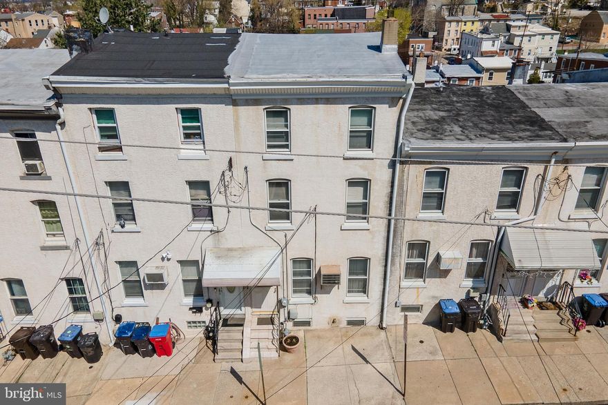 Calling all Investors and first-time home buyers!!! Opportunity abounds for you at 447 Sandy St in Norristown! This 4 bed, 2 bath home on a quiet street is ready for you to make a profit or make it your own for your family! Bring your paint swatches and design ideas as this place is big inside and an opportunity not to be missed. As you enter this home you will find a large open family room and dining room combination with ceramic tile floors that lead you into a large eat-in kitchen. Behind the kitchen is a covered back porch to enjoy quiet time with your family or pets. The backyard is fenced and has access to your walk-out basement. In the backyard there are stairs down to the back lot on 446 E. Airy St (also being sold as part of this property). Heading upstairs you will find 2 spacious bedrooms and a full bath with tub shower and bidet on the second level. On the 3rd level you will find 2 more spacious bedrooms with wood floors under any carpet or vinyl on this level. You have a full basement with natural gas heat and hot water! The basement has a full bath, but it will need to be fully remodeled. There is also back yard access plus additional storage from the walkout basement. As noted, this property also includes the rear adjacent vacant lot on 446 E Airy St that could be a wonderful backyard or potential opportunity to build another home or structure that meets your needs! This home is within minutes of shopping, restaurants, breweries, history and entertainment in King of Prussia, Bridgeport, Conshohocken and Philadelphia with easy access to I-76, Rt 202 and the PA Turnpike. Property is being sold as-is (in its present condition - no repairs no credits from seller), buyer is responsible for obtaining Use and Occupancy and water is currently turned off in the home at the main so please do not attempt to use bathrooms. Showings begin on Tuesday 4/1/2025.