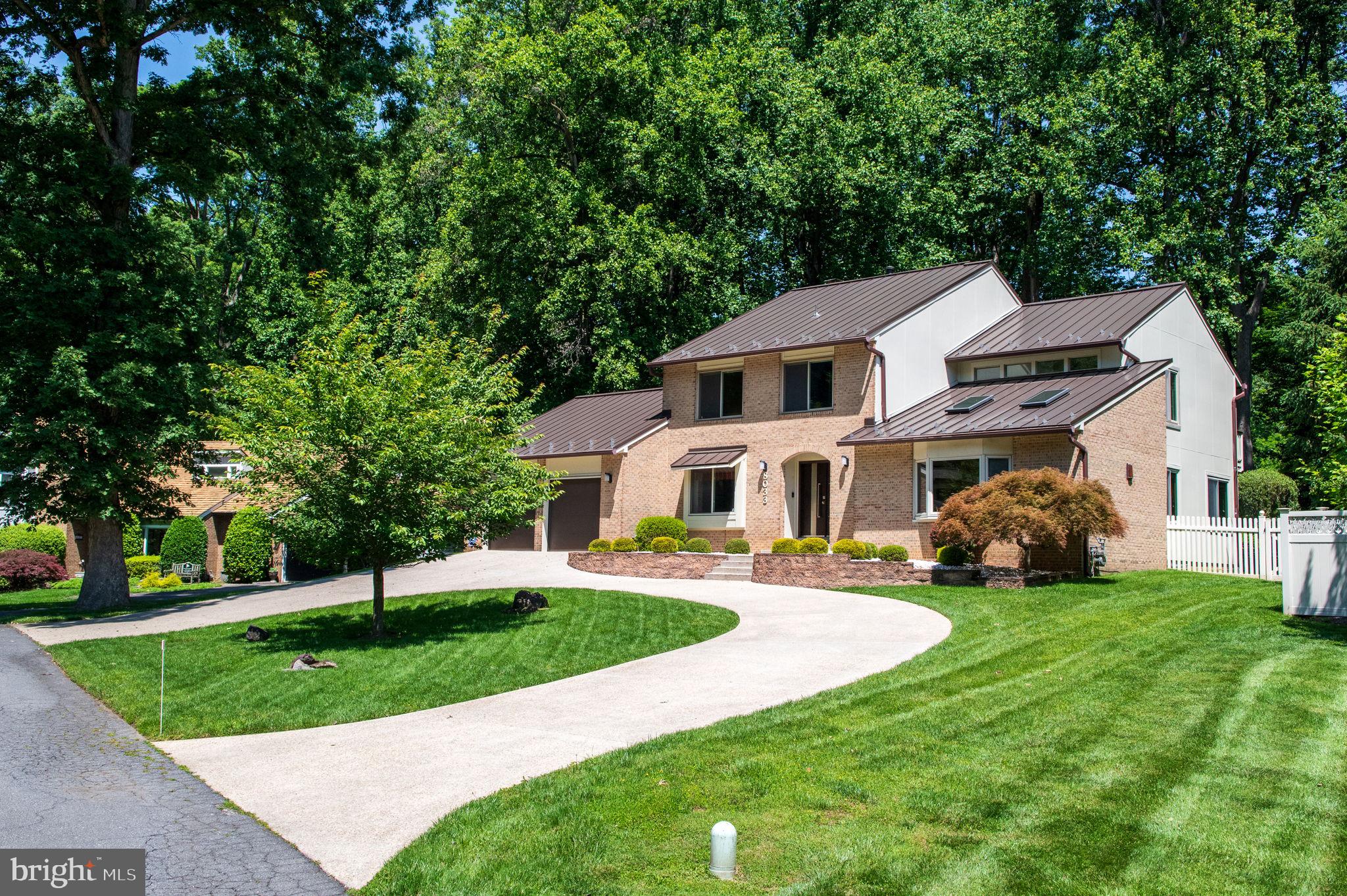 Welcome to this stunning 5 BR/3.5BA contemporary residence nestled in the sought-after Cabin John Evergreen neighborhood on a quiet cul-de-sac, situated on a spacious lot size of 0.56-acres. This home boasts excellent curb appeal with its stylish circular driveway centered in the front yard complemented by lush landscaping, and manicured gardens that enhance its overall aesthetic.
Inside, a welcoming foyer with elegant marble flooring opens to the gorgeous living room with vaulted ceilings and skylights, hardwood flooring, a large bay window that flood the space with natural light. The main level includes a formal dining room area with a new sputnik chandelier, a spacious chef’s kitchen with granite countertops complemented by a spacious breakfast area and a gorgeous family room with gas fireplace. Two sets of double sliding doors from the Family RM and Breakfast RM seamlessly open to the huge deck, creating an inviting indoor- outdoor living. A 5th bedroom on the main level, currently used as a home office offers convenience and flexibility. The newly updated laundry room with new LVP floor and a utility sink for added convenience.
Upstairs, the large primary suite includes sliding doors opening to a private balcony with new floor, offering a serene retreat. The remaining three. bedrooms are spacious and well-appointed.
The large finished basement provides additional living space, complete with a full bath, a gym with wall of mirror making it ideal for recreation or guest accommodations. The beautifully landscaped backyard is a true outdoor oasis, featuring a serene fish pond with a tranquil waterfall.
Additional Features: Premium quality METAL ROOF(2020), known for its exceptional durability, longevity and energy efficiency. Entire House Hardie Plank siding in 2020, New Water Heater in 2023, Replaced Main A/C Unit in 2020, Entire Attic insulation replacement in 2020, Washer & Refrigerator in 2021, Fresh Paint, No HOA. Top-rated schools: Bannockburn ES, Pyle MS, and Walt Whitman HS!