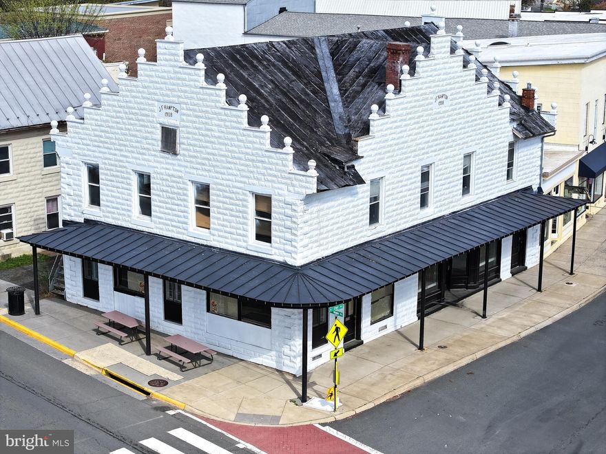 Flagship Corner Property with Tax Credit Incentives & Approved Mixed-Use Redevelopment Plans-Downtown Purcellville
An exceptional investment opportunity awaits in the heart of historic downtown Purcellville. Known locally as The White Palace, this iconic corner property is primed for transformation. With the interior already fully gutted, a Certificate of Design Approval secured, and eligibility for up to 45% in combined state and federal historic tax credits, this project offers a rare combination of vision, value, and velocity.

Whether you're a boutique hotel developer, a restaurateur looking for dual concepts, or an investor seeking long-term value in one of Loudoun County's most affluent communities, The Palace is your platform for a standout commercial asset.

Property Highlights:
Flexible mixed-use zoning ideal for a boutique hotel, dual restaurant concepts, event space, or creative commercial uses

Approved architectural plans include 4 hotel rooms on the second floor and 3 on the third, with two commercial storefronts at street level

Basement build-out potential to expand usable square footage and income streams

Directly across from a public parking lot, offering easy access for guests, patrons, and tenants

High-visibility corner lot in a walkable district poised for continued revitalization

Located on 21st Street, which is under consideration for a pedestrian-friendly streetscape as part of the town's economic development strategy

Designated as part of Virginia's Main Street Program, enhancing eligibility for additional incentives and support

Strategic Growth Location
Situated in Loudoun County-one of the wealthiest regions in the U.S. with a median household income exceeding $150,000-Purcellville is home to nearly 10,000 residents and continues to attract high-income professionals and families seeking charm and convenience.

The upcoming Rt. 690/Rt. 7 interchange will dramatically enhance east-west and north-south connectivity, channeling increased traffic into Purcellville's commercial core-directly benefiting The Palace's position and exposure.

Why Invest in The Palace
Potential for up to 45% in historic tax credits to offset renovation costs

Ready-to-execute development with plans and approvals in place

Strong future income potential through hotel stays, restaurant tenants, and commercial leases

Premium corner lot with public parking and high foot traffic

Located in a revitalizing district with long-term growth upside

Access to a high-income, pro-business market in Loudoun County

With site work initiated and major entitlement hurdles cleared, this is your opportunity to establish a legacy property in one of Northern Virginia's most desirable small towns.