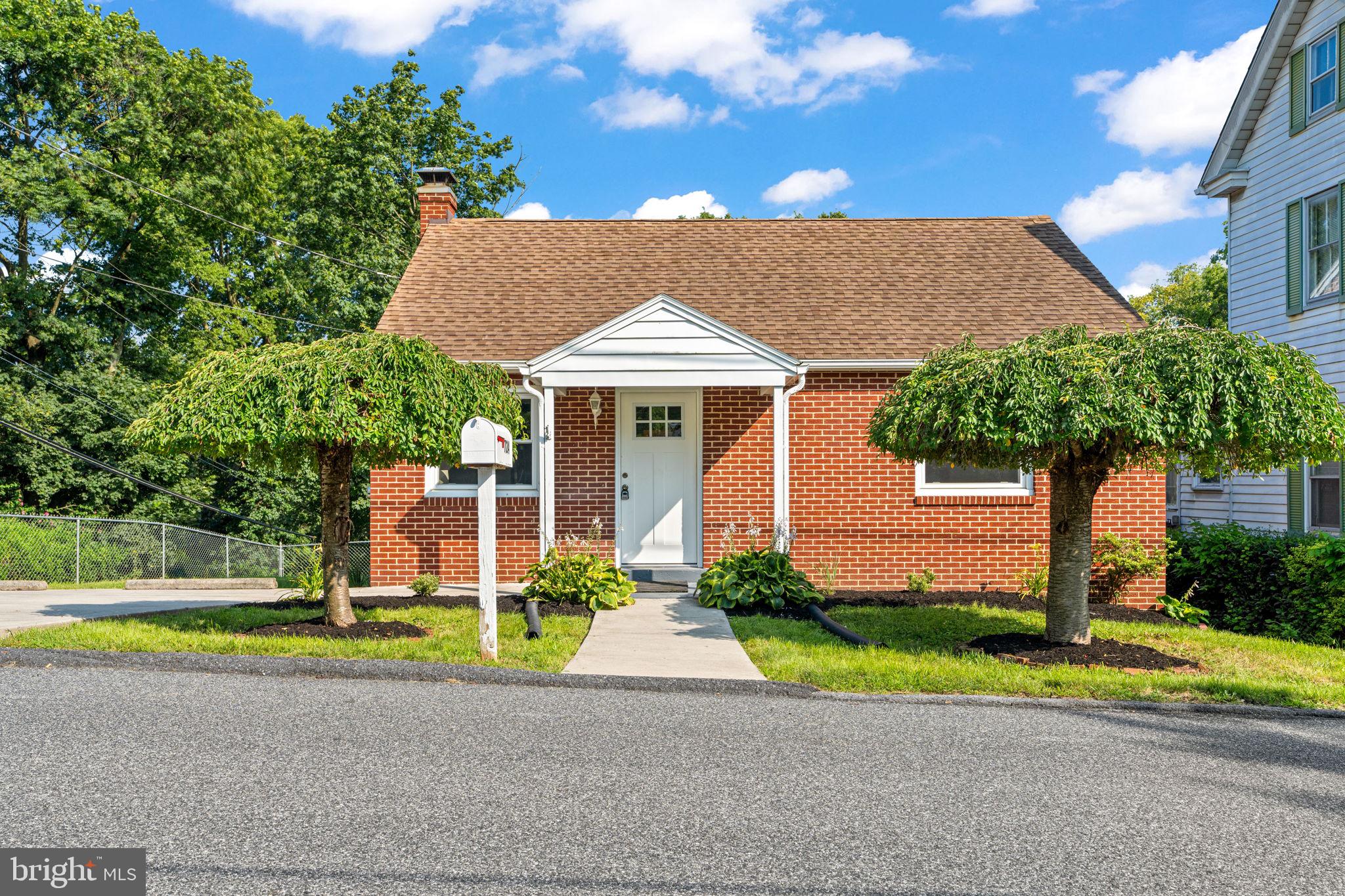 This home is a must see! As you arrive, you'll love the curb appeal with the freshly manicured landscaping, the craftsman front door and brick exterior. Feel free to park off-street in the paved driveway that overlooks the spacious backyard and generously sized covered deck. Enter the front door into an open concept floor plan which makes entertaining a breeze! The kitchen has been redone with a tiled backsplash, new appliances, and plenty of cabinet space. Also on the main floor is a freshly renovated full bathroom and two bedrooms. Head downstairs to the walk out basement which provides flexibility with a third bedroom or second family room, a closet and a full bathroom featuring a walk-in shower. Home also features thermal pane windows with tilt in sashes and a newer roof. There is no shortage of storage in this home with an unfinished section in the basement as well as a large expandable second floor. Schedule a showing today and come see yourself in this home!
