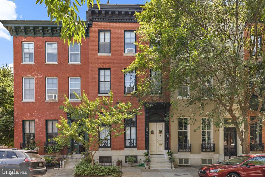 Discover timeless elegance in this stunning 4-bedroom, 4.5-bath townhome located in the heart of historic Bolton Hill. Situated on a picturesque, tree-lined block, this home beautifully marries modern amenities with classic architectural details. Enjoy gourmet cooking in a kitchen outfitted with stainless steel appliances, and unwind in the luxurious master bath complete with a custom walk-in closet.

The home's original charm shines through its seven fireplace mantles, hardwood floors, and intricate plaster moldings. Step outside to a private brick patio and garden, perfect for relaxation and entertaining, with the added potential for one-car off-street parking.

Spread across four levels of finished living space, this home offers abundant room for both living and hosting. Enjoy the community’s vibrant lifestyle with a short walk to the train station, Bolton Swim & Tennis Club, and the area’s finest amenities. The wonderful courtyard and lawn add to the appeal, making this home a perfect blend of historic charm and contemporary comfort.