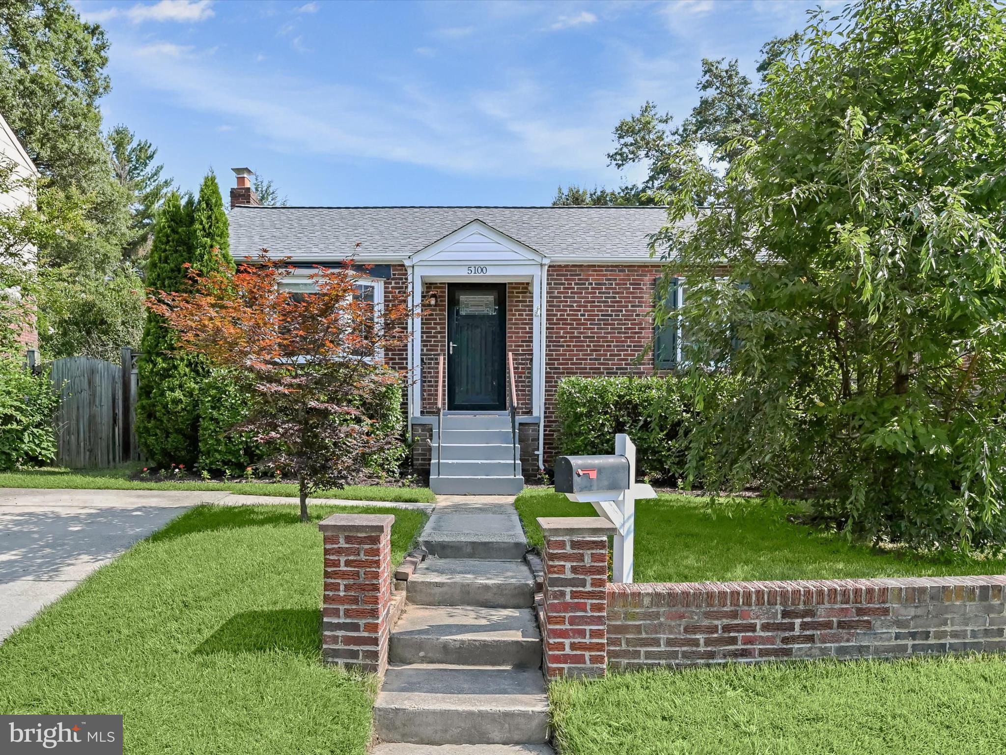 Nestled in the desirable Hollywood community of College Park, this brick bungalow charms from the curb with its blooming window boxes and inviting presence. Inside, upgraded interiors and thoughtful finishes create a warm, welcoming atmosphere perfect for both everyday living and entertaining.
Step into a bright and spacious living room, where a wide bay window invites in natural light and gleaming hardwood floors stretch seamlessly throughout the main level. Just beyond, the open kitchen and dining area serves as the heart of the home, beautifully renovated with crisp white cabinetry, a classic subway tile backsplash, gleaming granite countertops, and stainless steel appliances including a gas range. A door from the kitchen opens directly onto the deck, providing easy indoor-outdoor flow for morning coffee or weekend barbecues. Two main-level bedrooms offer comfort and convenience, while the full bathroom boasts timeless design with its subway tile tub and shower surround. The lower level expands your living space with a generous family room, a third bedroom, and a second full bathroom. This layout is ideal for guests, roommates, or multi-generational living. A large laundry room with a side exterior exit adds functionality, and a flexible bonus area offers the perfect spot for a home gym, hobby space, or added storage. Out back, the fully fenced yard provides a private retreat, complete with a spacious deck for lounging or dining al fresco, and a storage shed for keeping outdoor gear organized. A private driveway and additional permit street parking ensure practical ease for you and your guests. Perfectly situated near the University of Maryland and the vibrant Route 1 corridor, this home also offers quick access to major commuting routes and the scenic trails of Greenbelt National Park. Just blocks away, the Greenbelt Metro Station and MARC train make commuting into D.C. and beyond a breeze, while the nearby Trolley Trail provides a scenic, car-free path for walking, running, or biking to local shops, parks, and restaurants. A true blend of charm, updates, and location, this bungalow is ready to welcome you home. Please note: rooms depicting furniture have utilized virtual staging.