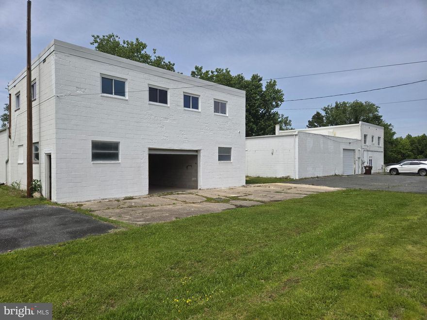 A bargain for two block buildings zoned General Commercial of 8,800 square feet with mixed used , adaptive use, and apartments, on second floors.  Room for expansion on a .8-acre lot. Easy access to Ocean Gateway MD route 50 for transportation. Outside lot space in the back, front and sides is convenient to use.  West building contains approximately 2,780 square feet of first floor space.  The East building first floor space is of approximately 2,850 square feet with approximately 760 square feet as former offices and full bath. First floor ceilings with steel, truss girders are in both buildings.  Height of ceilings from bottom of girders to concrete floors is approximately 11 feet. The West building apartment has recently been updated and is like new. The West building apartment is a 3 bedroom, 1 bath while the East building's apartment is of 3 bedrooms two baths where second full bath is attached to a bedroom. New roofs have been installed. Two new overhead garage doors have been installed as well. A survey and recorded Plat completed in 2022.