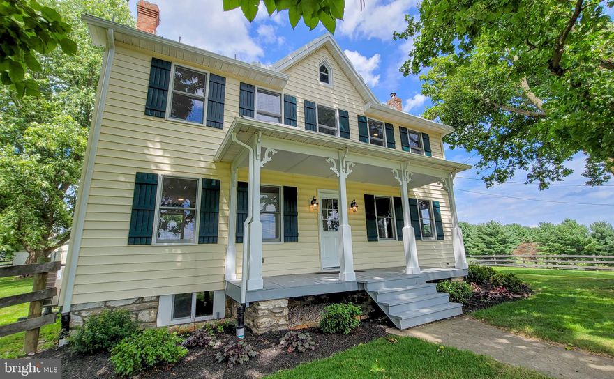 Absolutely stunning traditional farmhouse style home has been completely renovated, top to bottom.  It sits perched at the top of almost an acre of country-side property, and is the ultimate combination of new materials and restored classics. No detail has been overlooked--this home has been lovingly reimagined with the finest materials and quality workmanship. All new appliances (Zephyr range hood, Thermador gas pro stove, convenient microdrawer, and more), new wiring, new energy efficient lighting, new plumbing, new dual zone HVAC units with bonus supplemental heat, new drywall, new gutters/downspouts, and so much more, plus is freshly painted in soft neutral tones.  Original 1880's heart pine floors were beautifully refinished throughout the home, and are accented by the aesthetically correct choice of solid wood rustic beech finish cabinetry (with soft close drawers!) that echo the character wood quality of the flooring and tie the kitchen and great room to the rest of the home seamlessly.  Many of the original doors can be found throughout, and tons of exposed brick and original trim was incorporated into the design wherever possible. There is a new woodstove with brick hearth and convenient dry-bar with minifridge/icemaker in the dining room, which also could be used as the perfect home office or library.  The bathrooms are model home quality, and come complete with all the benefits of modern convenience and luxury, including dual sinks/vanities in the primary bathroom, and a showpiece standalone classic soaking tub, and both feature large custom-tiled showers with built-ins.  Outdoors, there is nearly an acre of pastoral property for you to enjoy, with sunrise views from the large primary bedroom balcony, and lovely sunset views from the entertainment-ready flagstone patio located off of the great room.  There is ample parking for multiple vehicles, and both a dog kennel/chicken coop and equipment shed are ready for your homestead needs. There is no other place around like this - and this is definitely not to be missed.
