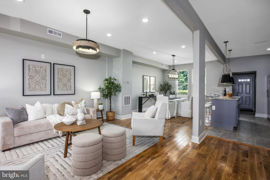 This fully renovated 4-bedroom, 2-bath home features brand-new electrical, plumbing, and HVAC systems, along with hardwood floors throughout (NO CARPET), and porcelain tiles in the basement. The modern kitchen is fully equipped with high-end finishes, and the finished basement includes an additional bedroom and full bathroom—ideal for guests or extended living space. Enjoy a private, fenced-in yard, a rear parking pad, and a welcoming front porch. Conveniently located near Morgan State University and Johns Hopkins University. Schedule your private tour today!