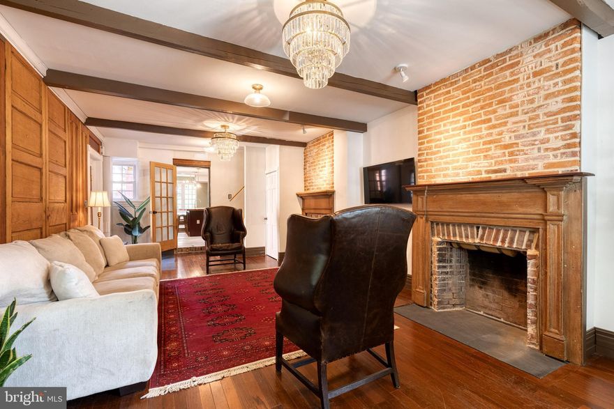 A charming three-story, three bedroom rowhouse that offers character and convivence on the most desirable, tree-lined cobblestone street in Federal Hill. A brand-new rooftop deck was completed in May 2024, offering fantastic views of the Inner Harbor waterfront and skyline and a perfect vantage point for Fourth of July fireworks. Enter the home through the wide living room with two fireplace mantels, offering plenty of room for entertaining adjacent to the kitchen and a dining room/family room at the back of the home leading out to the backyard. Primary bedroom faces backyard with a walk-in closet and en-suite bath. Two other bedrooms offer plenty of space for family and guests. Both bathrooms were renovated in 2023, one with an open concept rainfall shower, a free-standing soaking tub, floor-mounted faucet, and Carrera marble tile throughout. Kitchen offers 48" commercial Viking range with six burners and a 12" griddle with dual fuel ovens. Sophisticated Pottery Barn chandeliers and West Elm lighting fixtures have been installed throughout the home. Owners have installed a new heat pump (2024), new Pella front windows (2024) and a new flat roof (2023). Top public elementary/middle schools located nearby on the Southern Baltimore Peninsula: Fed Hill Prep, Thomas Johnson and Francis Scott Key. The neighborhood offers a wonderful sense of community amongst friendly neighbors.