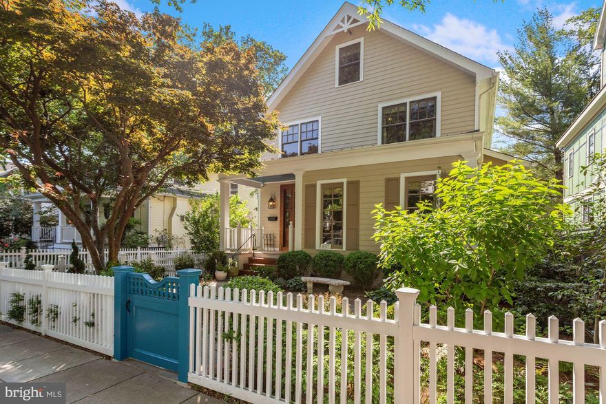 This beautiful house is located on a quiet tree-lined street in sought after Kent. While its traditional charm remains intact, this home has been thoughtfully expanded and renovated by Chryssa Wolfe and Hanlon Design to meet the highest standard of modern living. A white picket fence with a cheerful blue gate open up to a lovely front garden. The main level features a gracious foyer with stunning custom cabinetry, a large formal living room with a coffered ceiling and fireplace, and a comfortable formal dining room. The kitchen comes well equipped with top-of-the-line appliances and opens to a light filled and well proportioned eat-in area offering access to a delightful screened-in porch that overlooks the yard and swimming pool. A bright and airy family room is located just off of the kitchen. A charming library with custom bookshelves as well as a powder room are also found on this spacious and functional level. The second level offers three bedrooms, including the generous primary bedroom which has an updated bathroom, spectacular oversized closet room, sitting area and porch with views of the beautiful yard.  A renovated hall bathroom and laundry room are also located on the second level. The top level has a sizable bedroom with space for an office and an updated full bathroom as well as ample storage space. The lower level has an office area with custom built-in cabinets, a full bathroom and a private entrance. The rear yard is a sanctuary with multiple patio spaces for entertaining and a large salt water pool with a power cover. This wonderful home is within walking distance to Key Elementary, Palisades Recreation Center and a host of shops and restaurants.