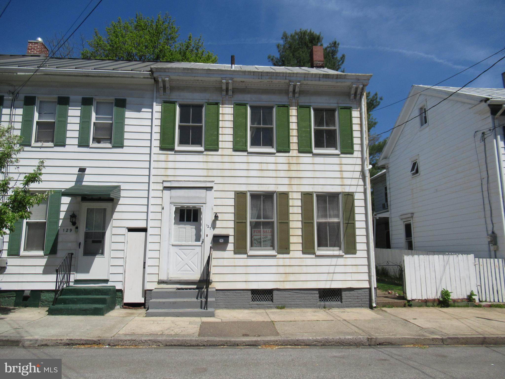 Spacious (1,544 sq. ft) townhome has living room, office area, three bedrooms, two full baths, large eat-in kitchen and beautiful staircase. The large yard extends to a Borough alley.....potential for off-street parking (currently fenced).