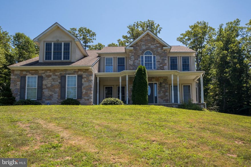 Breathtaking nature surrounds this move  in ready, charming colonial bordering the MD/PA line.   4 bedrooms, 2  1/2 baths,  Large family room with an absolutely gorgeous stone fire place.  1st Floor Library/Office and Laundry room.   Enormous master bed room with walk in closet plus two additional closets.   Relax in the jacuzzi tub and feel like you are in a resort.    Numerous windows throughout the house for plenty of natural light.  This home has a energy efficient heat pump. Invite  family and friends to this private and wooded outdoor backyard, perfect for entertaining. Enjoy cooking on  your custom built stone BBQ Grill and Fire place.   How cool will it be to watch your children four wheeling in your own back yard!  South Western Schools.