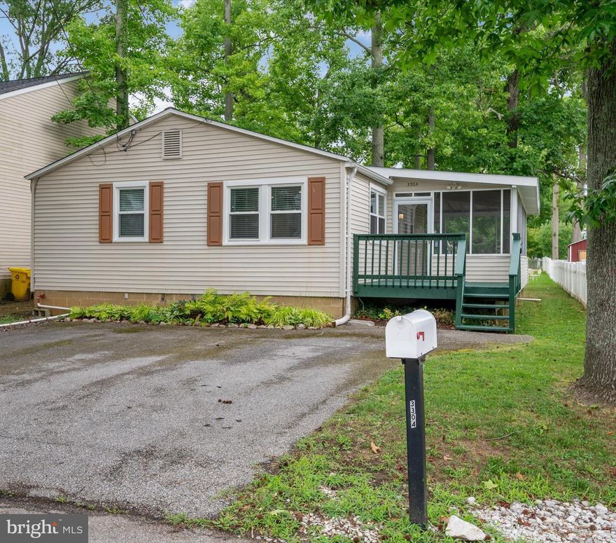 Oyster Bay, a special tax-benefit community, offers an abundance of amenities including water privileges on the Chesapeake Bay & Fishing Creek!  This adorable 2 BR, 2 Bath cottage with a wraparound screened porch offers limited water views from kitchen and living room, Upgrades & improvements included Roof was replaced in June 2024,  Crawlspace was professionally encapsulated in 2021, Kitchen remodeled in 2019 including granite countertops, stainless steel appliances and  upgraded cabinets, Both bathrooms remodeled in 2018, Windows replaced in 2019, HVAC replaced 2019, Submersible well pump replaced 2018, Hardwood floors in main area 2018 and carpet in bedrooms July 2024, Water filter & softener system replaced in 2021, Shed for your outdoor tools & toys and fire pit, Community amenities include playground, beaches (included a dog beach area), exercise circuit, kayak/canoe/paddle board racks, boat ramps, pier, boat slips are additional and as available, skate board, basketball, rock climbing;  Conveniently located to downtown Annapolis, major travel routes to DC, Baltimore & the Eastern Shore and near desire services and amenities,   Note - Community amenities are paid through taxes as a special tax community however boat slips are available for a fee and as available.