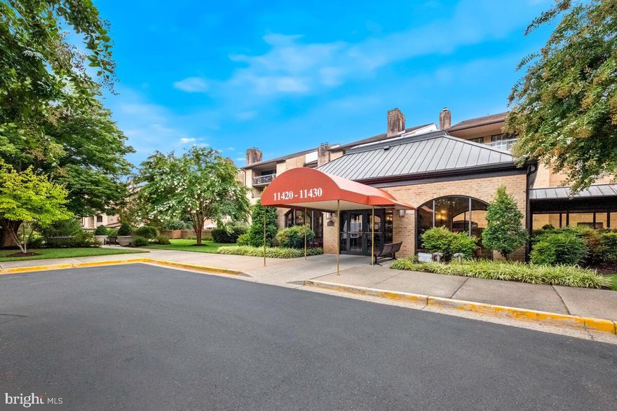 2 BEDROOMS PLUS A DEN & 2.5 BATHROOMS IN THE BEST LOCATION!
Best Community with a serene view from a new private flagstone patio.

Nestled in the serene and highly-desirable Old Georgetown Village community of North Bethesda, this beautiful two-level condominium home awaits.  
Boasting 2 generous bedrooms + DEN and 2.5 bathrooms, this home is designed for modern living and comfort with plenty of room to spread out.  Welcome and enjoy.

Upon entering, immediately notice the gorgeous wood floors throughout the main level.  The flowing layout is ideal with spacious living and dining areas ideal for hosting small gatherings or more intimate living.   The upgraded kitchen includes recessed lighting, granite countertops paired with a subway tile backsplash, abundant cabinetry, and stainless-steel GE appliances for all your culinary endeavors.  The dining area has built-in wall-to-wall cabinets for ample storage.  The living room provides easy access to the fenced patio surrounded by majestic mature trees that provide a serene atmosphere for enjoying private retreats and ultimate relaxation.

A sunken family room/den with a wood-burning fireplace and a built-in desk space could serve as a comfortable living space or as an office for hybrid and work-from-home professionals.

Upstairs are two generous bedrooms with ample closet storage.  The first bedroom features built-in wall shelving and cabinetry and is served by a full bathroom.  The primary bedroom boasts a huge walk-in closet and an upgraded bathroom with a shower stall.  The upper level has a laundry room for your convenience and also provides a second entrance from the first-floor hallway.

Convenience abounds!  This home comes with a secured garage parking space with storage room.  Amenities include a fitness center, tennis courts, pool, beautifully maintained walking paths, and much more.  The premium location of this home ensures everything you’ll need is within easy reach just moments away from Whole Foods, Starbucks, Seasons 52, Fogo de Chao and all of the other marvelous dining/retail options at Pike & Rose.  Super convenient to I-270, MD-355, and the Grosvenor Metro Station.  Your treasure hunt ends here!