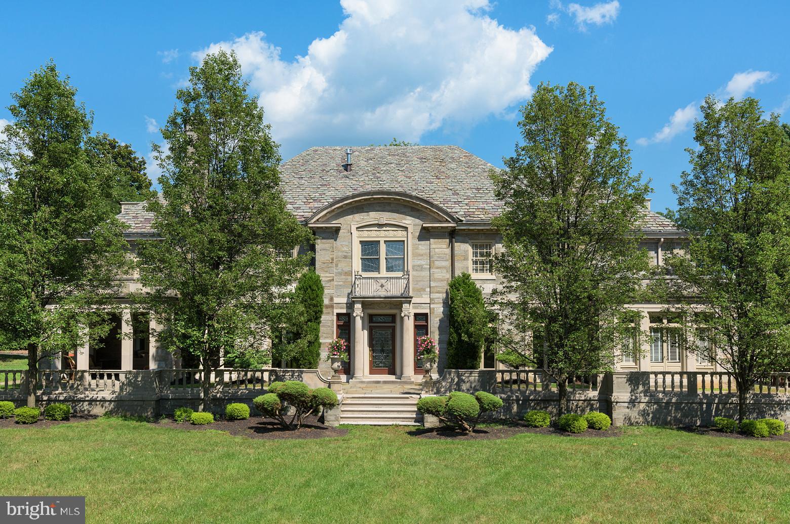 This Magnificent "One of a Kind" Mansion designed by the famous Philadelphia architects Rabenold & Seyburger has been restored and updated to perfection. Enjoy all the artistry of marble floors and Ornate Fireplaces and Fine architectural details in wood paneling, crown molding, and built ins. The gorgeous staircase features a barrel ceiling and Impressive Leaded stained-glass windows and doors. The huge gourmet kitchen opens to a breakfast area, wet bar and Sundrenched Family Room with Built-ins and Fireplace. The formal Dining Room and Livingroom flank a spectacular marble Entry both with gorgeous original fireplaces. The Fountain Room off the Formal Livingroom is freshly painted and features custom tile work and windows galore. Upstairs relax in the Library or experience the Luxury of a Huge Master Suite with Steam Shower, Dressing Area, Private Laundry and his/hers closets. The Two Additional Bedroom Suites on this floor feature gorgeous updated original baths. The third-floor houses 5 great size bedrooms and a black and white tile hall bath. A rear foyer connects the kitchen area with the garage and a fantastic In-Law Apartment above with white kitchen, granite tops, gorgeous tile bath, living room and bedroom. Room count includes the apartment. The Lower Level includes a snack bar area adjacent to a huge Home Theater and playroom. There is a laundry area and Pool access with His/Hers Bath and changing rooms...Outside enjoy a lovely kidney shaped pool, state of the art Sport Court and bocce court. This classic home offers everything todays family looks for!