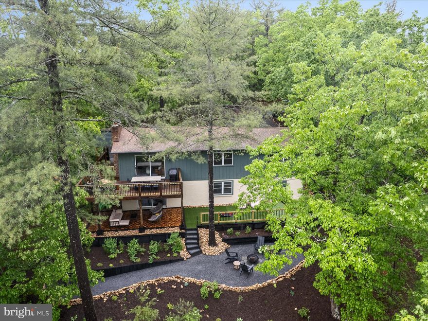 Impeccably Updated 3-Bed, 3-Bath Turnkey Retreat with Adjacent Lot and  Views

From the moment you arrive, it’s clear this property is something truly special. Situated on nearly one acre—including an adjacent vacant lot that offers future flexibility to build, expand, or sell separately—this beautifully updated 3-bedroom, 3-bathroom home is a rare find.

This home has seen some major renovations. Over the past few years, it has received a full interior and exterior transformation, blending modern design with refined comfort. Inside, the open-concept layout showcases a sleek, contemporary kitchen, inviting fireplaces, updated bathrooms, and stylish new flooring and decor throughout. The roofing, guttering, hvac and siding has also been updated (2013-14).

Outdoor living is equally thoughtful and functional. An updated deck with modern materials offers the perfect space for relaxing or entertaining, while professional landscaping includes multiple tiered retaining walls, a built-in fire pit, and a level lawn area ideal for cornhole or lawn games.

Adding to its appeal are the ridge top views enjoyed from the deck — which are even more expansive during the winter and autumn months—providing a tranquil and scenic backdrop whether you're enjoying your morning coffee or watching the sunset.

This property has never been used as a short-term rental, but it's turnkey-ready for that opportunity. It’s being sold fully furnished, making it ideal as a primary residence, a weekend escape, or an investment property. With the bonus of the additional lot, you’ll have room to grow—or the option to sell it separately in the future.

Whether you're dreaming of quiet mornings with scenic views or hosting unforgettable weekends with friends and family, this fully furnished retreat offers the lifestyle you’ve been waiting for.