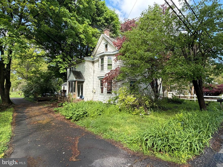 Discover a unique investment opportunity, located right outside the heart of Mechanicsburg! Nestled on a huge .77-acre lot within the (R2) Medium Density Residential Zoning of Upper Allen Township, with lots of possibilities! This charming two-story offers 2,150 square feet with bounds of character waiting for your vision and updates. Main level offers a large kitchen, formal dining, half bathroom, and multiple living spaces, including a 2-story great room with a wood stove. The second floor boasts a loft, 2 full bathrooms, and 3 large bedrooms, including the primary ensuite with a full bath and walk-in closet. The large detached garage may offer potential for a possible accessory dwelling unit. Seize this chance to invest in a property that combines historical charm with modern potential. Schedule your private showing today to see all this property has to offer!