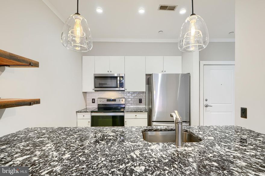 Nice condo at Woodberry/Hampden- 21211-2 bedroom- 2 bath with garage parking and pool-Nice community outdoor space-granite/stainless/washer/dryer- lots of local amenities nearby