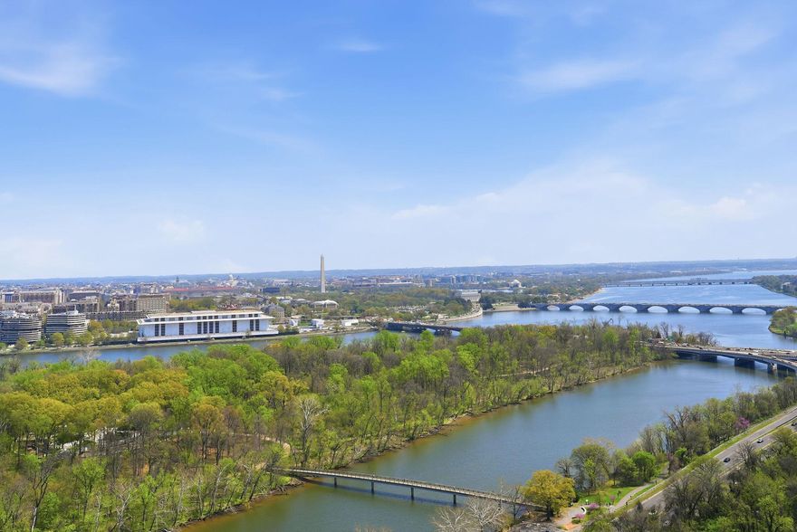 Experience elevated living at The Waterview—a rarely available luxury 2-bedroom corner residence perched on the 26th floor of the iconic Waterview in Arlington. Every room showcases breathtaking, panoramic vistas stretching across the Potomac River, the monuments of Washington, D.C., National Airport, The Pentagon, and the vibrant Rosslyn skyline.

Inside, the home blends modern elegance with comfort. The sleek, contemporary kitchen is outfitted with premium Miele, Sub-Zero, and Viking appliances, designed for both everyday living and sophisticated entertaining. Heated tile floors flow throughout the main living spaces, while the bedrooms offer plush wool carpeting for warmth and tranquility.

Residents enjoy 24-hour security and a friendly concierge, along with exclusive access to the building’s spectacular rooftop terrace featuring approximately 280-degree views spanning the monuments, Georgetown, the airport, and beyond. Entertain in style with the BBQ area, fire pits, lounge seating, and the option to reserve the rooftop for private gatherings.

Unbeatable convenience places you just one block from the Rosslyn Metro Station, surrounded by dining and shopping, and moments from the Francis Scott Key Bridge into Georgetown. One assigned parking space conveys.

This is luxury high-rise living at its most breathtaking—where every window frames a postcard view.