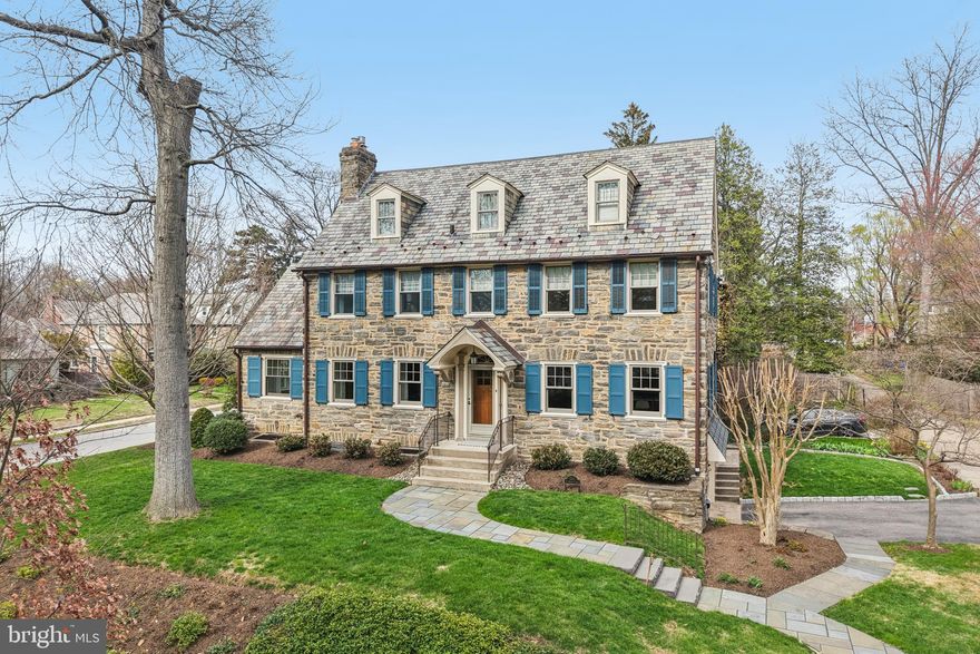 Meticulously Maintained Wissahickon Schist Stone Colonial in Prime Mt. Airy Location.
Welcome to this stunning 3-story colonial, beautifully constructed from solid, classic Wissahickon schist stone. As you approach the home via the elegant bluestone walkway, it is immediately clear that this is one of the most exceptionally maintained homes you will find on the market today. Owned by meticulous Sellers, this home perfectly blends original architectural charm—including a classic slate roof and charming blue shutters—with top-tier modern upgrades, including all-new Marvin windows and central air conditioning.
Step inside to a tiled entryway and satin finished hardwood floors flowing through a bright and airy floor plan. The spacious living room features a beautiful fireplace with a custom hexagon tile surround and classic French doors that open to a sunroom with deep window sills. Drenched in light, it is ideal as a dedicated study or reading room, or simply a cozy retreat for relaxing.
The formal dining room connects seamlessly to a breathtaking, fully renovated chef's kitchen. This space shines with custom navy cabinetry, pristine white quartz countertops, and a large center island with a gas cooktop/oven and bar seating. The premium appliance package was carefully selected, featuring a Jenn-Air oven, a Bosch refrigerator, and an ASKO dishwasher custom-paneled to blend flawlessly with the cabinetry.

Upstairs, the primary bedroom offers a luxurious, light-filled retreat. It features an elegantly updated en-suite bathroom with a glass-enclosed walk-in shower and custom blue penny-tile accents. A standout feature of the suite is the walk-in closet cleverly built into the architectural eaves of the roof and illuminated by elegant half-moon sunburst windows. Thoughtfully curated lighting and refined crown molding elevate the space with a polished, sophisticated feel. The second floor offers two additional sunlit bedrooms, one featuring built-in bookshelves and currently serving as a home office. A full hall bath completes the level, showcasing classic white subway tile accented by a blue mosaic border and timeless hexagon floor tiles. The finished third floor offers incredible flexibility. While the space functions perfectly as bedrooms—complete with unique built-in storage nestled into the dormer eaves and its own dedicated full bathroom with a shower—its flexible layout makes it an ideal setup for a private guest suite, a flex room, or an additional upper-level office.
Adding even more valuable living space, the partially finished basement provides over 500 square feet of versatile room, complete with a convenient powder room. This lower level also offers egress to the rear of the home as well as direct access to the oversized one-and-a-half-car garage, providing plenty of room not just for parking, but for easily storing garden tools, bikes, and outdoor gear.

Location is everything, and this home delivers. You are perfectly situated just 0.4 miles from the Chestnut Hill East line's Mt. Airy Station, making commuting a breeze. Nature enthusiasts will love being a mere block away from access to the scenic Cresheim Valley trail, while everyday conveniences are close at hand with the ACME supermarket, a post office and Market Square shopping just 0.7 miles away.

Details matter and from top to bottom, this property delivers. From thoughtfully selected window treatments throughout to the beautifully restored original door hardware and a new kitchen door crafted in the home’s original style, every element reflects exceptional care. The next owner will truly benefit from the remarkable attention to detail the current owners have invested.

This impeccably cared-for home is truly a rare find! Showings begin Friday, April 3rd.