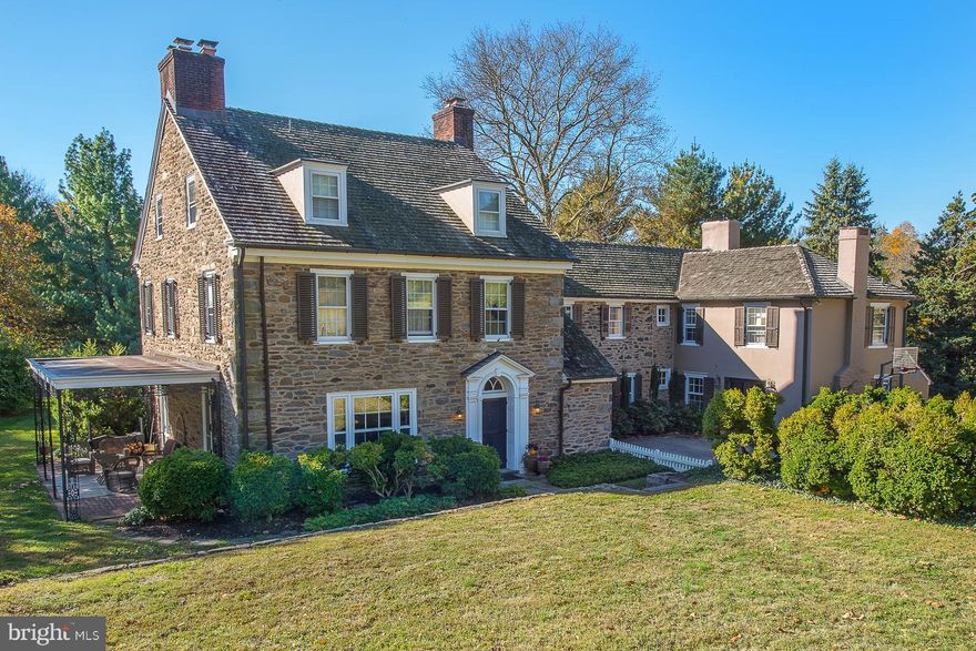 Nestled far back from the road is a gracious Walter Durham stone colonial home, set on 2+ rolling acres. There are  6 bedrooms generously  sized , 6.5 baths, and 6 fireplaces. Spacious, light-filled rooms feature wonderful millwork, oversized, original, French doors, gorgeous, random-width, pegged oak floors and deep window sills. In addition to the main home, the property includes a detached 3-car garage/carriage house with a 2-story loft suitable for conversion to a nanny / in-law suite or studio space as well as a charming stand alone root cellar.  Enter through the center hall with open stairway to the wood-paneled library, expansive living room and elegant dining room, which all have working, wood-burning fireplaces.  A powder room, coat room and service area with wet bar is also accessible from center hall. Kitchen with cherry cabinetry, vintage Delft and Country Floor tiles includes a glass-enclosed breakfast nook and fireplace. Adjacent family room connects to a step-down playroom/au-pair suite with a full bath. The Master bedroom suite on the second floor has an abundance of closet space, a fireplace and sitting room/baby nursery, along with an updated marble bathroom with jetted soaking tub, large glass-enclosed shower and Herbeau fixtures. This floor also has 3-4 additional bedrooms, 3 full bathrooms, a hall linen closet, and storage/ironing room. The third floor hosts 2 large bedrooms with plenty of closets and a full bathroom. This home is a Class 2 Historic property with an original portion built in Circa 1800's. The last addition was constructed in 1939 by Walter Durham. It is rare to find such a classic beauty, carefully updated to meet the needs of today's family. One year Home Warranty comes with purchase of home!