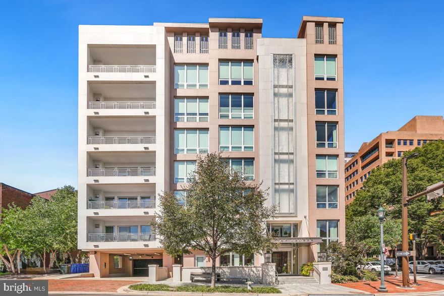 Sophisticated luxury living in downtown Bethesda's prestigious building, The Lauren.  
Welcome to The Lauren, an exclusive boutique condominium known for its refined style and exceptional service. This spacious two bed, two and a half bath condo with den/office offers 2,264 sq. ft.  An extremely quiet, light-filled corner residence, where you have no neighbors on either side, #107  will welcome you and your guests into its large foyer, with two double coat/storage closets. From there you will walk into the  kitchen with high-end stainless steal appliances, marble countertops, and oversized kitchen island with seating.  The open living area is perfect for entertaining, featuring a gas fireplace and built-in shelves.  The space also features a nicely sized den/office with pocket doors for privacy, and  a half bath. The large laundry room with sink leads to the large owner's suite with its abundance of closets.  The luxurious primary bath has a dual sink vanity, soaking tub, and separate shower. On the other end of #107, is the second bedroom with ensuite full bath, providing comfort and privacy for guests.  The sale includes two garage parking spaces with EV charger (#60 & #61 ), a storage unit (#19), and a private wine locker (#16) in the Onyx Lounge. The buildings' amenities include an elegant lobby with 24-hour concierge & secure access, on-site management, engineering staff, plus a rooftop terrace with a caterer's kitchen, the Onyx Lounge/party room with caterer's kitchen, and a gym/fitness center. And the best part of all- you are literally steps from all the shops and restaurants Downtown Bethesda has to offer! From the moment you walk into The Lauren lobby, no other building defines luxury like this.