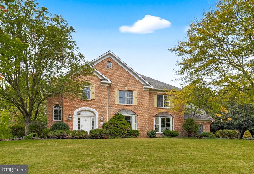 Parade of Homes Grand Prize–winning home by Jeff Henry in the coveted Brittany neighborhood. This stately, four-sided brick masterpiece sits on a beautiful 0.55-acre lot and offers 5 bedrooms, 4 baths, and 6,276+ finished sq ft of elegant living space designed for effortless entertaining and everyday comfort.  A gracious foyer introduces formal living and dining rooms with hardwood floors, while the dramatic two-story great room showcases a grand wood-burning fireplace, vaulted ceilings, and arched Palladian windows overlooking the brick patio—perfect for indoor/outdoor living.  The custom chef’s kitchen anchors the home with granite surfaces, a center island and breakfast bar, built-in appliances, a generous dining area, ceramic tile flooring, and a true walk-in pantry. Upstairs, 9-foot ceilings and handsome built-ins define the landing and loft.  The luxury primary suite is a retreat unto itself with double-door entry, a flexible nursery/office/sitting room, fireplace, expansive walk-in closet, and a spa bath with whirlpool tub and separate shower.  The finished lower level extends the living space with a large recreation room, game/guest room, office, homework/creative station with built-ins, and a full bath—ideal for guests or multi-use living with convenient direct access to the garage.   Additional hallmarks include dual staircases, zoned HVAC, central vacuum, in-ground sprinkler system, and an oversized 3-car garage.  A rare opportunity to own an award-winning home that blends craftsmanship, scale, and timeless style—schedule your showing today!