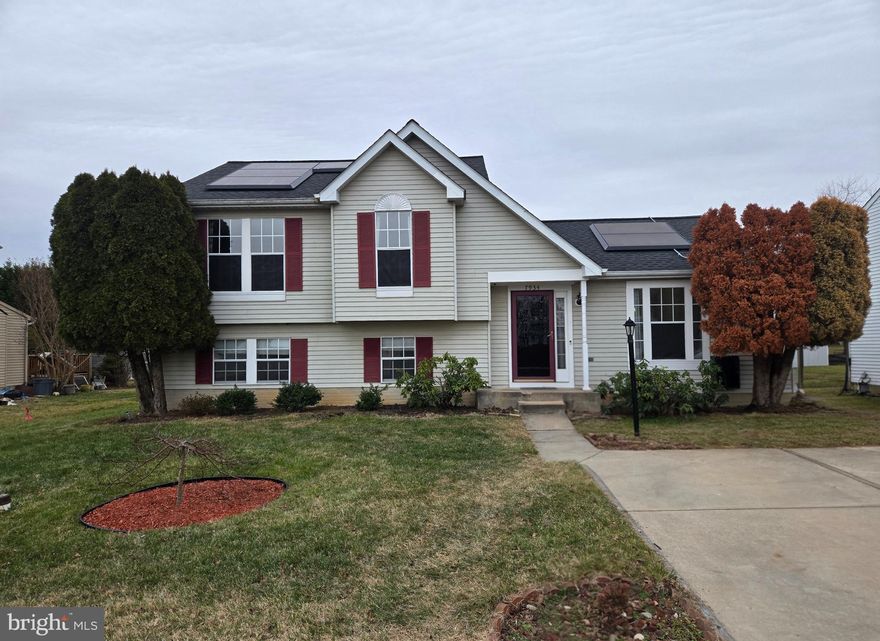 Welcome to this beautifully maintained and thoughtfully Maintained split level home offering the space, efficiency, and features today’s buyers are looking for. Enjoy the comfort of a detached home at a highly attractive price point, perfect for first time buyers or anyone seeking value without compromise.

This home offers three bedrooms plus a flexible lower level that can serve as a fourth bedroom, home office, or guest space, along with three full bathrooms. The main living and dining areas feature cathedral ceilings that create an open and airy feel, flowing seamlessly into the updated kitchen with stainless steel appliances.

The lower level has been raised to create an immersive movie theater experience, making it an ideal space for entertaining or relaxing at home. Additional highlights include a four seasons sunroom addition overlooking the backyard, adding valuable year round living space filled with natural light.

Major systems have been updated for peace of mind, including a roof approximately five years old, a new HVAC system and water heater approximately two years old, and fully paid off solar panels. The solar system also includes two energy storage batteries and an electric vehicle charger, providing energy efficiency and long term savings.

Situated on a landscaped lot in a quiet Windsor Mill community, this home offers a rare combination of space, modern upgrades, and energy conscious living.