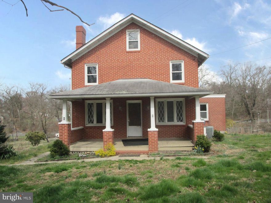 Welcome to this charming farmhouse-style home nestled on a generous 0.85-acre lot, offering ample space for tranquility and expansion. Crafted with enduring brick, this residence exudes timeless appeal, featuring a welcoming front porch that beckons you to unwind and savor the peaceful surroundings.
Though in need of some tender loving care, this home is a blank canvas awaiting your personal touch. With its desirable acreage, farmhouse allure, and untapped potential of the attic and basement, this house invites you to envision the possibilities and make it your own.  Some photos have been Virtually Renovated to provide a visualization of the property potential.