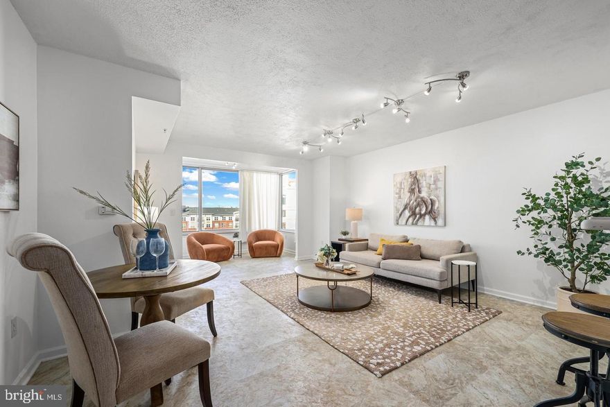 This sunny 10th-floor unit offers 1 bedroom plus a huge den with French doors, giving you workspace or guest flexibility alongside over 1,000 square feet of living space. Enjoy an east-facing sunroom with skyline views, an updated kitchen with new LVT flooring and newer stainless steel appliances (microwave 2024, dishwasher 2022), gas cooking and a breakfast bar open to the living/dining area. The generously sized bedroom includes a walk-in closet, and the home features a brand-new HVAC installed in 2025 and in-unit washer/dryer. The pet-friendly, secure building offers a rooftop pool, fitness center, business center, party room, outdoor patio and garage parking. Steps to the Dunn Loring Metro, Harris Teeter, dining, and just minutes to the Mosaic District and Tysons. Available Immediately!