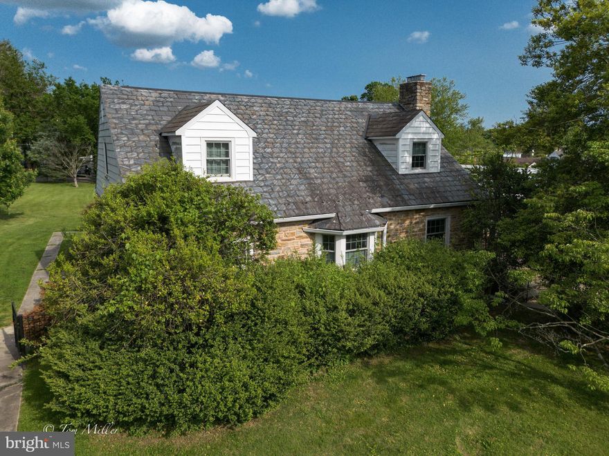 This property is being sold with an additional  buildable lot - both properties must be sold together! Rare opportunity to control what to do with the second lot - many options . This home is a classic stone and sided cape cod with covered front porch.  Has all kinds of character! - hardwood floors throughout, two bedrooms, one full bath on the 1st floor as well as an additional office and sunroom too! Living room, dining room combo and kitchen round out the 1st floor. There are two large bedrooms and a large updated bath on the second floor.  The larger  bedroom leads to a 2nd floor deck! Lower level is spacious and ready to be updated.  The second lot fronts Round Oak Ave in the rear - both the main property and building lot are level and ready to go.