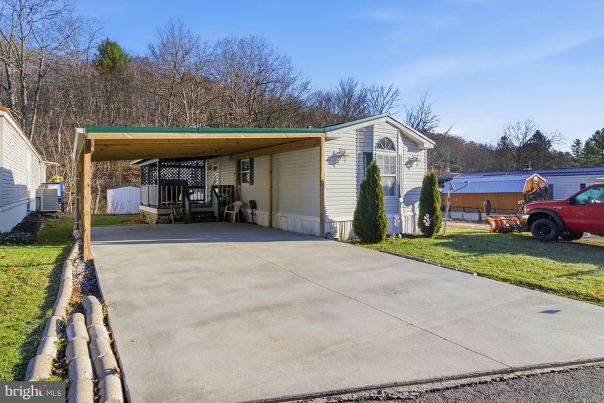True one-level living awaits in the quiet & friendly Lynn Wood Hills Mobile Home Park. This peaceful setting is just minutes from town conveniences & located only 1.3 miles from the West Branch of the Susquehanna River, perfect for fishing, kayaking, or simply soaking up the view. It’s a serene perk that adds to the charm of this welcoming community.  Whether you're looking to downsize or purchase your first home, this property offers an affordable opportunity with plenty of room to make it your own. Enjoy off-street parking, an attached carport, covered porch perfect for your morning coffee, a manageable lot & a location that balances privacy with accessibility.  Inside, you'll find vaulted ceilings & a sun-filled open concept split floor plan. The spacious living room invites relaxation or gatherings with friends and family. The light & bright kitchen features laminate flooring, a cheerful dining nook, ample cabinet storage & plenty of countertop space for meal prep. A handy laundry room with exterior access adds convenience.  The primary bedroom offers 2 closets & a full private bathroom with an oversized vanity & a generous walk-in shower with glass doors. Down the hall, you'll find 2 additional bedrooms & another full bathroom. A storage shed is also included to meet your organizational needs.  Lot rent is $260/month & includes exterior maintenance, road upkeep & snow removal on public roads. All potential buyers must be approved by Lynn Wood Hills Park Management.  Schedule your private showing today & discover the comfort, convenience & charm this home has to offer.