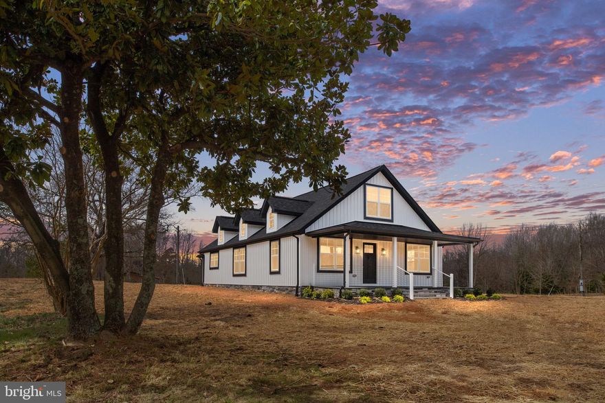This stunning 4-bedroom, 3-bathroom home has been remodeled from top to bottom, blending modern updates with farmhouse charm. Situated on nearly 5 acres of usable land, this property is ready for you to create your dream homestead or farmette.

The main level features an inviting open-concept design with LVP flooring throughout the main living areas. The spacious living room, dining area, and gorgeous kitchen flow seamlessly together. The kitchen boasts two-toned cabinetry, quartz countertops, a large eat-up island, and ample storage space. The main level also includes two generously sized bedrooms, including a primary suite with double closets, a spa-like ensuite bathroom with a large tiled walk-in shower, marble tile flooring, and a double vanity. A second full bathroom completes the main floor.

Upstairs, you’ll find two additional spacious bedrooms and another full bathroom. Relax on the covered front porch or enjoy the serene views from the back patio overlooking your property.

Additional features include a circular driveway, a new well, and a one-car detached garage, perfect for storage, hobbies, or a workshop. Conveniently located just minutes from the Spotsylvania VRE, I-95, shopping, and a variety of restaurants, this home offers the perfect balance of privacy and accessibility.

This fully remodeled home on 4.37 acres offers endless possibilities—schedule your showing today!