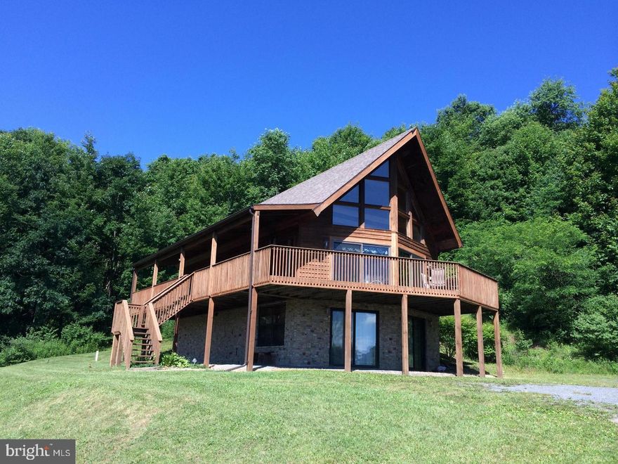 Don't miss out on this Ceder and stone A-frame with lots of privacy and NO HOA.  You Can enjoy the beautiful views and sounds of stream from the huge deck and wrap around covered porch. Soaring ceilings, tongue and groove, stainless steel appliances, gas stove, stained concrete in lower level. New zoned hvac, propane furnace and water heater. Close to all lake activities.