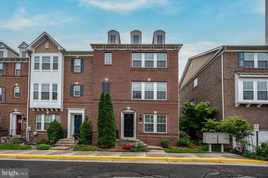 Finding a home in Alexandria with nearly 3,000 square feet, a true two car garage, and a Metro commute under a mile is rare. Finding it in an end of row setting that feels open, bright, and easy to live in makes this one stand out immediately.

Less than a mile to the Huntington Metro Station, this 2011 built brick Colonial offers nearly 3,000 square feet of light filled, functional space designed for everyday living. The end unit position brings in additional windows and a sense of openness you simply do not get in interior rows, while still offering the low maintenance lifestyle that makes townhome living so appealing.

The main level flows naturally from living to dining to kitchen, anchored by a fireplace that makes the space feel warm and inviting. The kitchen is designed for both daily life and entertaining, with a large island, upgraded countertops, stainless steel appliances, double wall oven, and cooktop, opening directly to a dedicated dining area. Just off the kitchen and dining space, a private balcony creates the perfect extension of the home for morning coffee or unwinding in the evening.

On the entry level, a versatile bonus room offers the perfect setup for a home office, additional living space, or whatever best fits your lifestyle. A full bathroom with access from both the hall and the bonus room adds flexibility that is hard to find.

Upstairs, the spacious primary suite feels like a true retreat, complete with an ensuite bath and room to unwind at the end of the day. The additional bedrooms are well sized and thoughtfully laid out, complemented by a full hall bath. Laundry is conveniently located on the bedroom level, making everyday routines that much easier.

Recent updates provide added peace of mind, including HVAC replaced in 2021, furnace replaced in 2020, and water heater replaced in 2023. Additional improvements include a microwave replaced in 2020, offering a blend of original construction and thoughtfully maintained systems throughout the home.

Set within the established Huntington Mews community, this home offers easy access to Alexandria, Old Town, the Pentagon, and major commuter routes, while still feeling tucked away. Opportunities like this, with this amount of space, a two car garage, and close proximity to Metro, rarely come available here. This one is worth seeing in person!