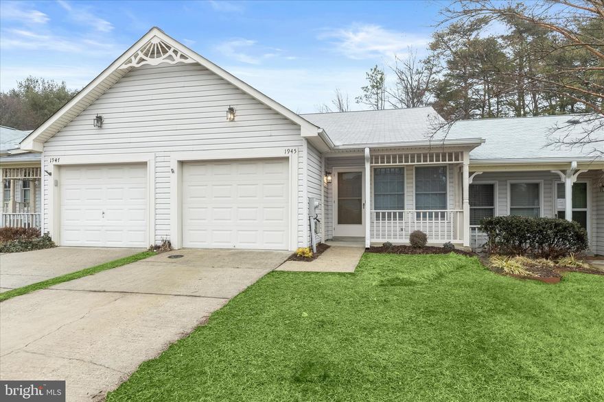 Set within the sought-after 55+ community of Heritage Harbour, this renovated townhome villa offers the ease of one-level living paired with stylish, modern updates throughout. A covered front porch welcomes you inside, where a beautiful neutral color palette, mid-tone vinyl plank flooring, new carpeting, new water heater, and updated kitchen, bathrooms, and light fixtures create a warm and cohesive first impression. The spacious living room features a vaulted ceiling that enhances the open feel and flows seamlessly into the dining room, where the vaulted ceiling continues, creating an airy space ideal for everyday living and entertaining. Just beyond, the renovated kitchen stands out with soft-close shaker-style cabinetry, quartz countertops, a tile backsplash, and stainless steel appliances, including a wine fridge. A center island with a breakfast bar provides additional seating and workspace, making the kitchen both functional and inviting. Off the kitchen, a convenient laundry room offers direct access to the one-car garage. Down the hall, the primary bedroom serves as a comfortable retreat with two closets and a private en-suite bath. The second bedroom features a walk-in closet and a sliding glass door that opens to the deck, offering a peaceful connection to the outdoors. Both bathrooms have been thoughtfully renovated with tile flooring, tile tub and shower surrounds with decorative inlay, and cohesive modern fixtures that tie the spaces together beautifully. Outdoor living is extended with a deck, perfect for enjoying quiet mornings or relaxing afternoons. Parking is well accommodated with a one-car garage, driveway, and ample guest spaces throughout the community. Beyond the home, Heritage Harbour offers an exceptional lifestyle. Residents enjoy waterfront access to a marina with boat slips, a community pier, and kayak and canoe storage. Two resort-style pools, including one with a hot tub, invite relaxation, while a state-of-the-art fitness center and fully equipped woodshop support active and creative pursuits. With clubs and social groups for golf, tennis, pickleball, and more, plus a café, Par 3 golf course, newly renovated tennis courts, lively pickleball matches, and a billiards room at the waterfront lodge, this community blends comfort, luxury, and connection in an extraordinary setting.