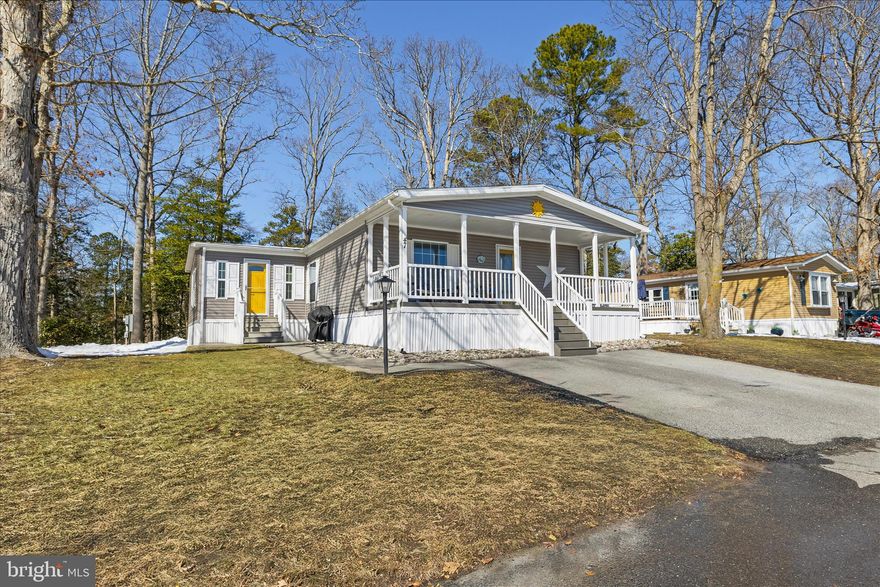 Welcome to 47 Branchwood Drive, where coastal charm meets modern comfort just minutes from the boardwalk in Rehoboth Beach! This2019 home offers the perfect blend of easy living and stylish finishes! Step inside and discover a bright, open-concept living space with a split floorplan (owners suite in the back, guest rooms in the front) that feels welcoming and spacious. The heart of the home is undoubtedly the beautifully outfitted kitchen, featuring bright white cabinetry, gleaming stainless steel appliances, and enormous island with seating – perfect for casual meals or entertaining friends. Prepare to be wowed by the incredible new sunroom addition, with its vaulted ceiling  that creates an airy, expansive feel – it's the perfect spot for year 'round relaxation and living! The thoughtful design extends to the private owner's suite, a true sanctuary where you can unwind. The en-suite bathroom is a standout, featuring modern fixtures, convenient storage with dedicated linen cabinets, and a separate water closet for privacy and convenience. The 2 additional bedrooms are equally comfortable and well-appointed, sharing a full bathroom, and offering plenty of space for family or guests.
For those everyday tasks, you'll absolutely love the dedicated, separate laundry room. This isn't just a closet; it's a thoughtfully designed area complete with ample cabinets and generous countertops, offering all the room you need to tackle laundry day with ease! Outside, the front of the home greets you with a generously wide front porch, ideal for enjoying morning coffee or evening breezes, while the backyard offers a large shed for storage of bikes, lawn tools, beach toys and more, and backs to a mature forest, offering a wonderful sense of privacy and natural beauty. The well-maintained exterior and inviting curb appeal complete the package. Located in sought-after Rehoboth Beach, you're just a stone's throw from all the best attractions; beaches, boardwalk, water park, outlet shopping, and delicious dining options, all of which make coastal living so much fun! There's even a convenient DART bus Park 'n Ride just down the street, eliminating the need to find parking at the beach.  Water and trash pick up are included in the low rent. Park application required for residency. Approval based on credit and background checks, review of debt to income ratio, and verification of income/assets.  2 pet max. Comcast/Xfinity service available. Optional Pool membership (approx. $175/person, or discounted multi-passes avab).  Not suitable as an investment property: subletting is not permitted.