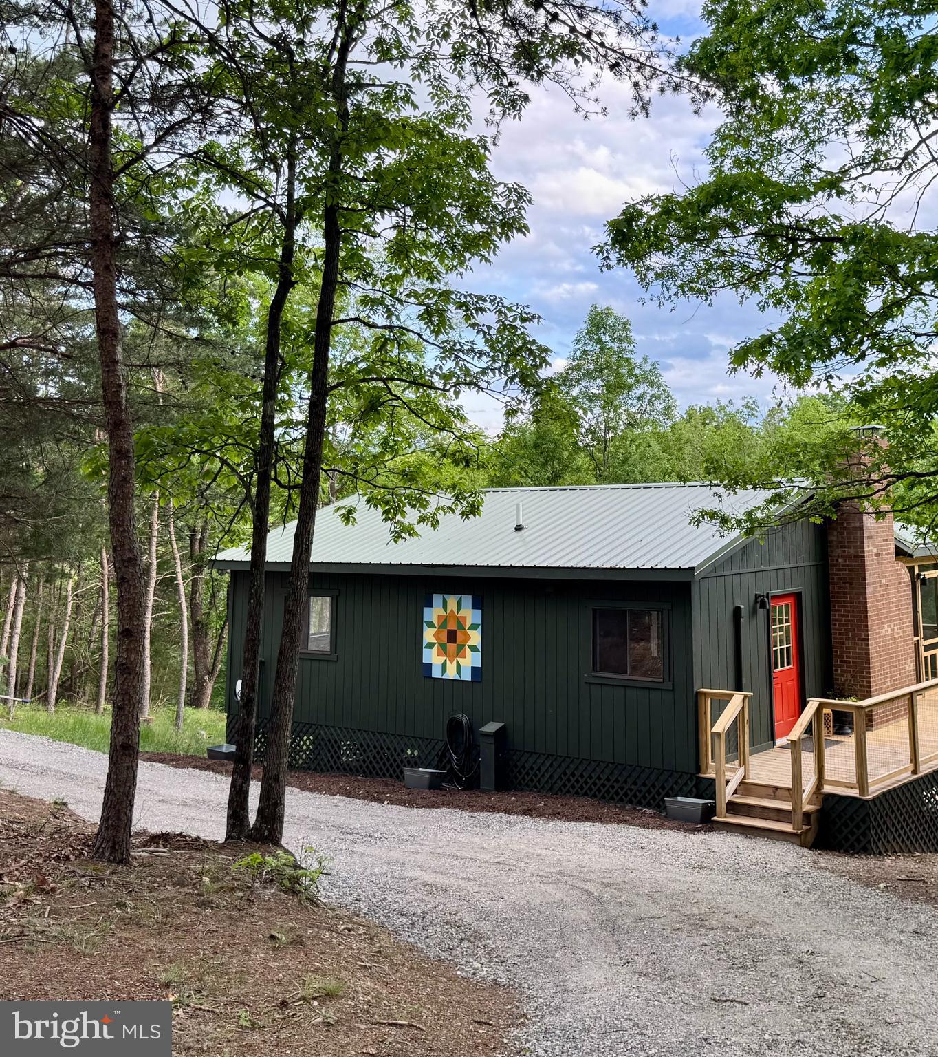 Welcome to your very own woodland retreat. Set on just over two acres on top of the ridge at the end of a cul-de-sac with a 2 level deck this home makes you feel a world away. Newly renovated with 2 bedroom and 2 bathrooms it is just waiting for it's new owner to add their personal touch. Featuring all new systems, flooring, metal roof, tesla car charger, fiber optic internet, heated floors in the en-suite bath and a wrap-around 2 level deck with screen room you can move right in and not worry about a thing. Synder's Ridge is one of my favorite communities in Lost River. It is truly a hidden gem. The only road in and out has a park like setting and the making it the perfect wooded trail for morning stroll with the pup and your coffee. The neighbors are the best around and don't be surprised if while on an evening walk you are invited in for drinks and some fun conversations. Minutes to Lost River State Park, Lost & Found Pizza & Provisions and LRV Gym and under 15 min to Lost River General Store, Lost River Farmers Market ,Lost River Butcher Block and the beach at Trout Pond Recreation center you will have plenty to keep you occupied. Call today to schedule a showing!