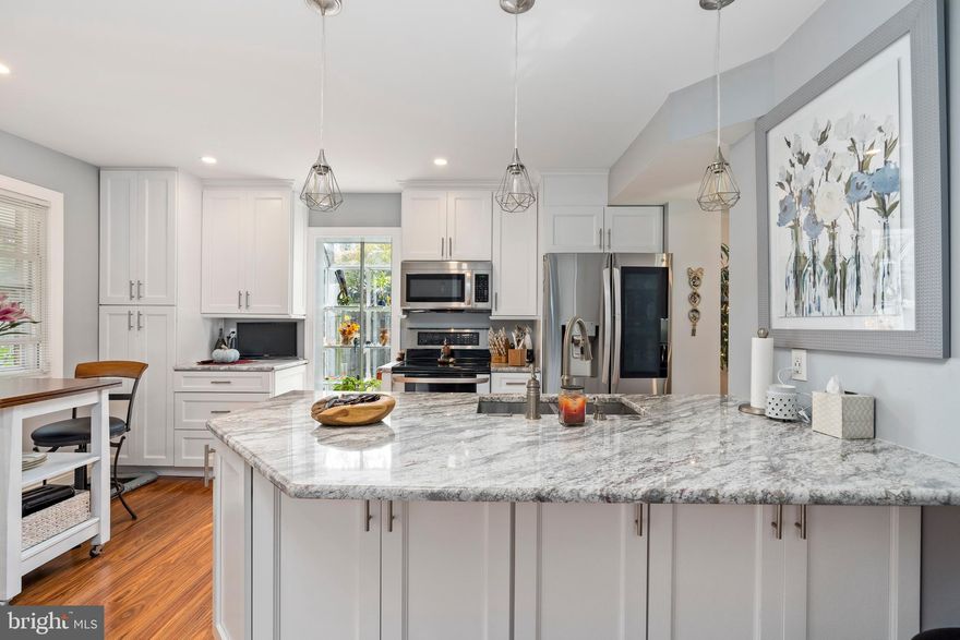 ***HIGHEST AND BEST DUE WED, 10/28 AT 12PM*** ONE OF A KIND!! Welcome To This Beautiful  End Of The Group Renovated 3 Bedrooms 2 Full Baths And 2 Half Bathroom Home. Walk In & Immediately Be Mesmerized By The Custom Work Put Into This Home. The Main Level Offers Luxury Laminate Floors Throughout The Living Room, Dining Room, & Kitchen. The Kitchen Offers Granite Countertops, Custom Cabinets, Stainless Steel Appliances, & Breakfast Bar. Living Room With Ton Of Natural Light & Coffered Ceilings. No Attention To Detail Was Missed. Walk-Up To The Upper Level, You'll Find 3 Spacious Bedrooms And 2 Full Bathrooms. The Master Bedroom Offers New Lighted His & Her Closets With Built-Ins , & Custom Tile Master Bathroom with A Rain & Wall Shower &  Double Vanity Sink . Finished Lower Level Offers A Large Family Room With Bar Area And Walk-Out To The Fenced In Back Yard.