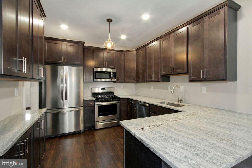 Longwood Village is a hidden favorite with it's super easy access to Route 1, yet within it's own charming & quiet community.  With lots of natural light and boasting a clean, modern aesthetic, this home has been fully leveled up with fresh flooring, sleek appliances, and granite counters that hit just right.  Basement has JUST been finished giving yet additional space for fun!  From the designer fixtures to the crisp cabinetry and new paint, every inch of this spot is giving immaculate vibes.  The location is a total flex, putting you within walking distance of your morning Starbucks, a late-night Wawa run, and essentials at Giant or TJ Maxx. When you aren't out exploring, you can kick back by the cozy fireplace or catch a breeze on the private (BRAND NEW) deck. Best of all, it’s peak easy living—the HOA handles the "adulting" chores like snow removal and lawn care, and there’s a massive unfinished basement to stash all your gear. Be ready to be impressed!  Seller is licensed real estate agent.