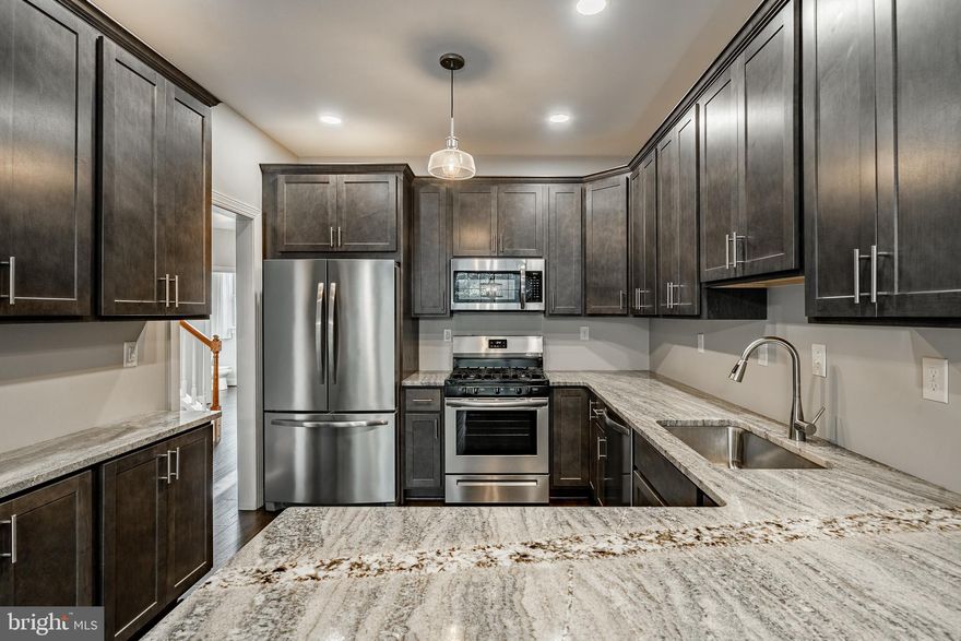 Priced reduced, motivated Sellers!East of downtown just down the street from Longwood; the hidden favorite Longwood Village offers super EASY access to Route 1, yet within it's own charming & quiet community.  With lots of natural light and boasting a clean, modern aesthetic, this home has been fully leveled up with fresh flooring, sleek appliances, and granite counters that hit just right.  Basement has JUST been finished giving yet additional space for fun!  From the designer fixtures to the crisp cabinetry and new paint, every inch of this spot is giving immaculate vibes.  The location is a total flex, putting you within walking distance of your morning Starbucks, a late-night Wawa run, and essentials at Giant or TJ Maxx. When you aren't out exploring, you can kick back by the cozy fireplace or catch a breeze on the private (BRAND NEW) deck. Best of all, it’s peak easy living—the ***reasonable***HOA handles the "adulting" chores like trash removal, snow removal and lawn  and even shrub care! Check out the massive expansion of Greenwood Elementary school just a 1/4 mile away! Seller is licensed real estate agent.