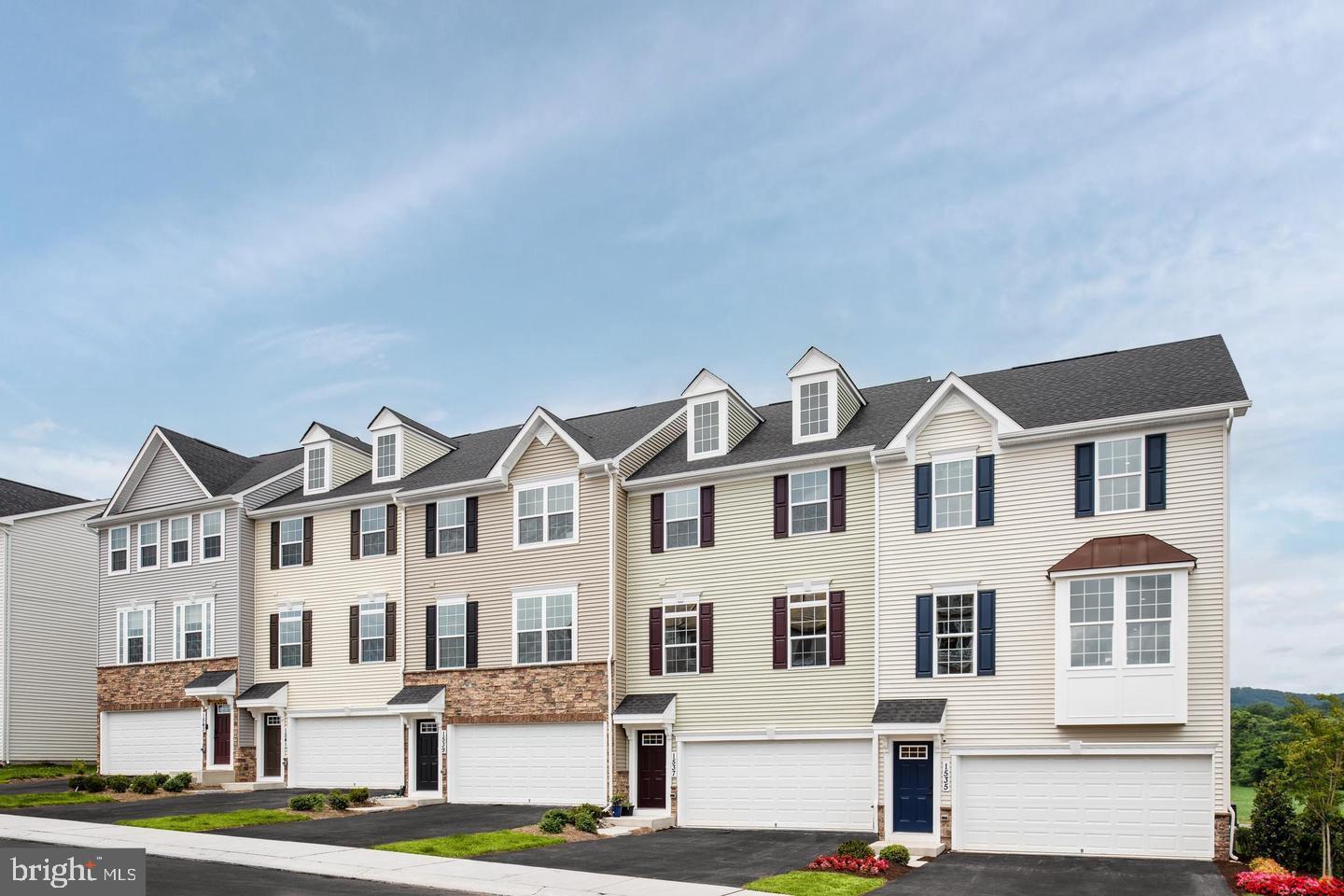 This newly constructed, spacious 3-level townhome in the desirable West Park Village community offers modern living with 3 bedrooms, 3 full bathrooms, 1 half bathroom, and a 2-car garage. The open-concept main level features a wide layout, ideal for both entertaining and everyday living, while the finished basement provides additional flexible space, perfect for a recreation or media room. Abundant natural light enhances the home's inviting atmosphere. Conveniently located just minutes from downtown Frederick, residents enjoy close proximity to shopping, dining, and entertainment, all within walking distance. Commuters will appreciate easy access to major routes, including US-40, I-70, and US-15, with a short drive to Baltimore, Washington D.C., and Leesburg. This beautiful townhome offers the perfect blend of comfort, style, and convenience.